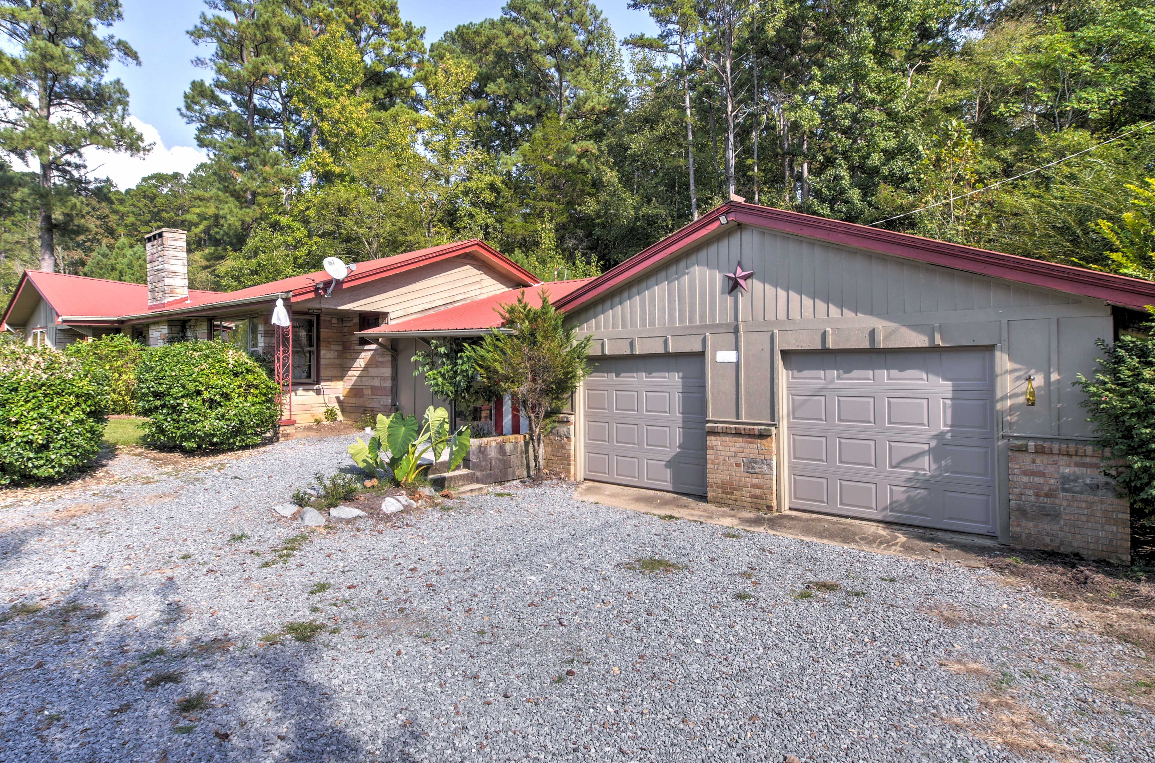 The gravel driveway provides ample parking for guests.