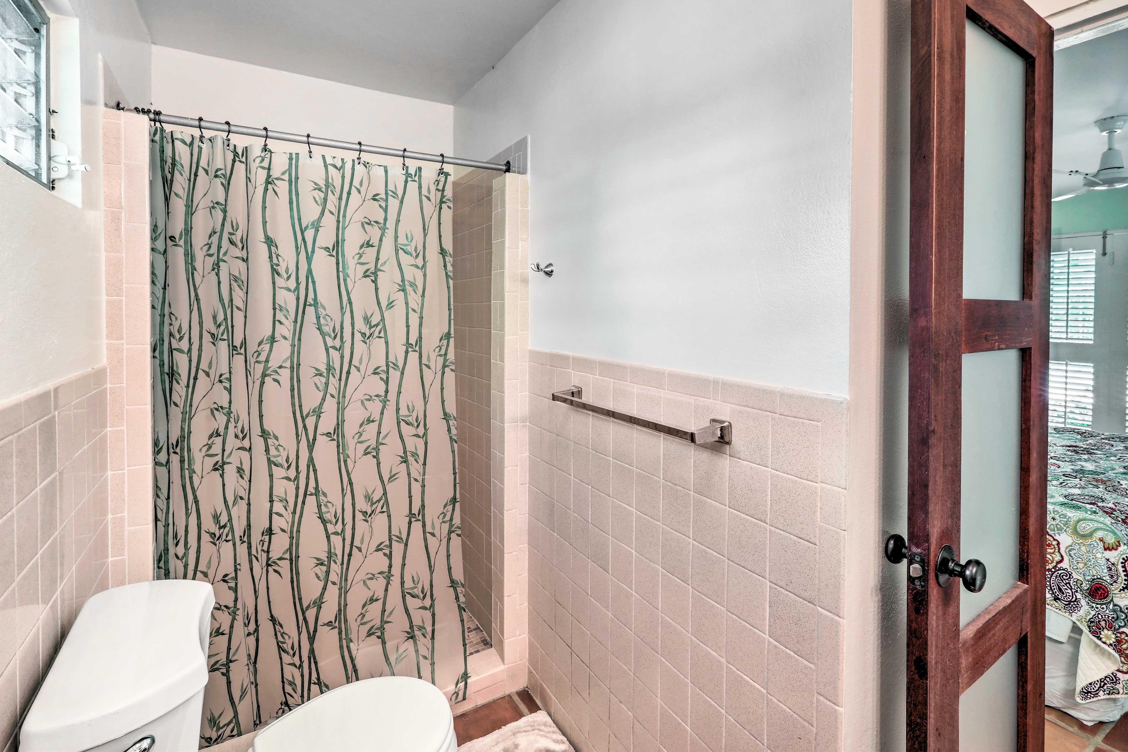 Rinse off in this walk-in shower featured in the first bathroom.