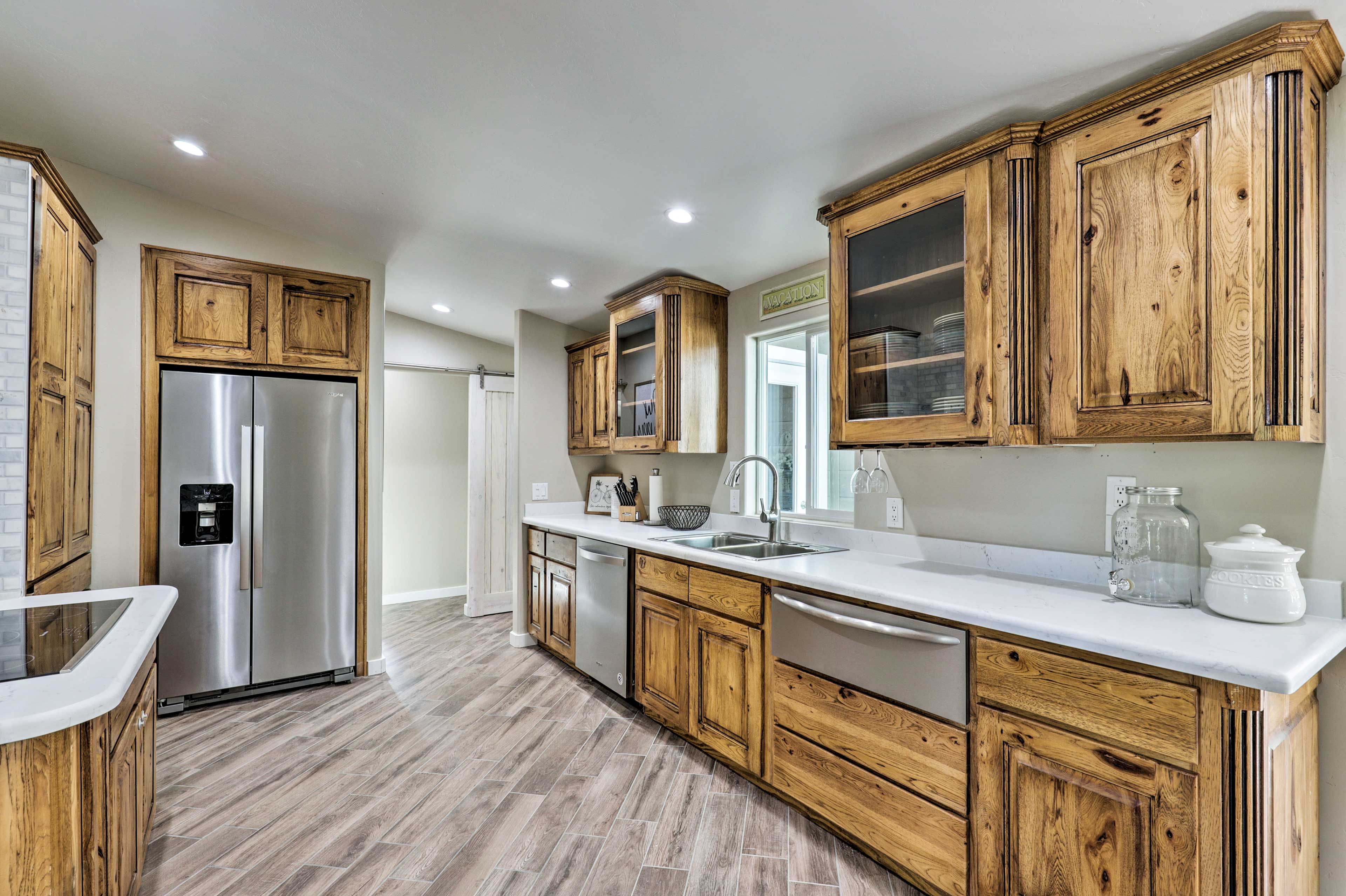 The kitchen boasts high-end stainless steel appliances.