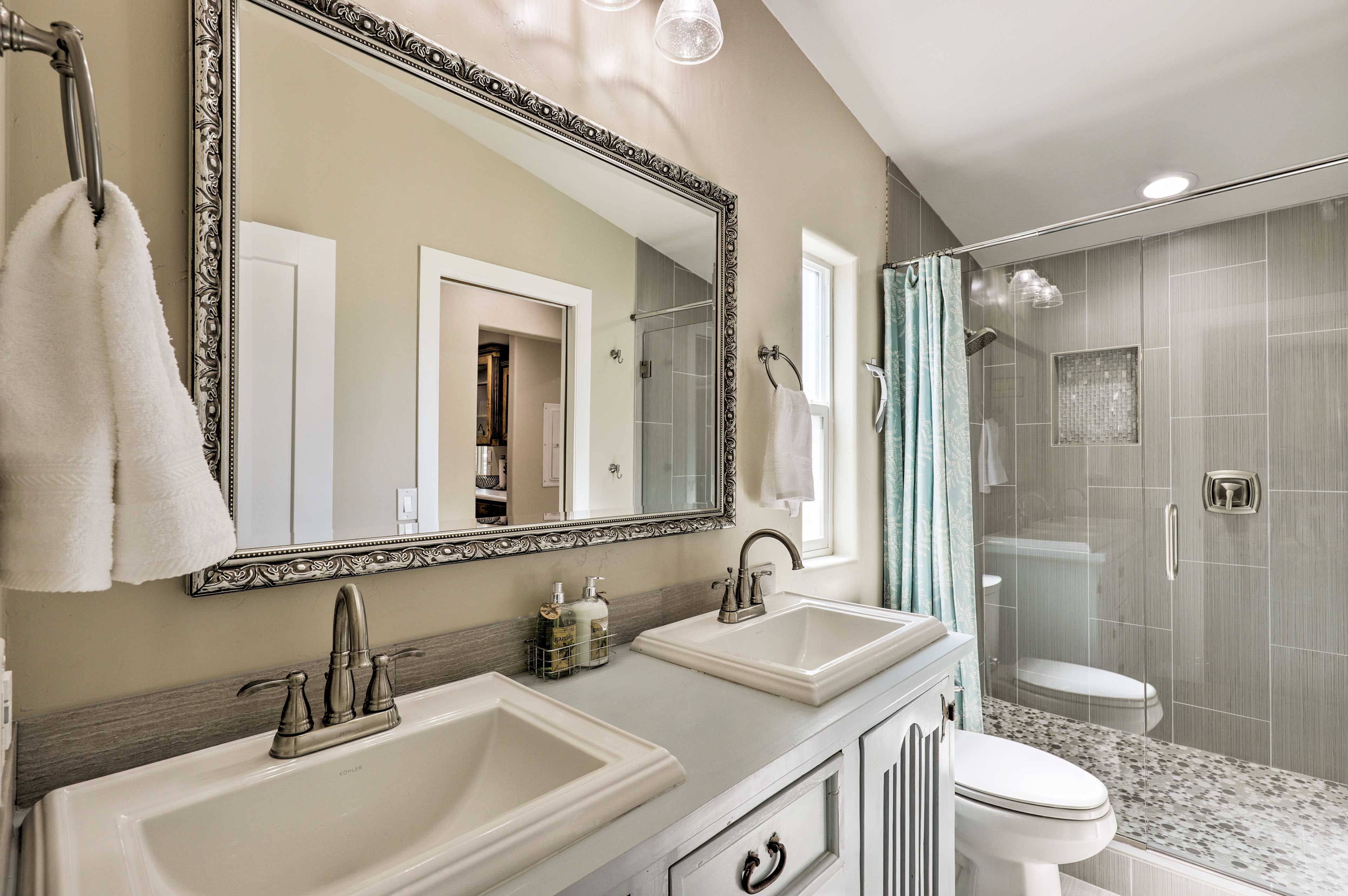 The first full bathroom boasts a lavish walk-in shower.