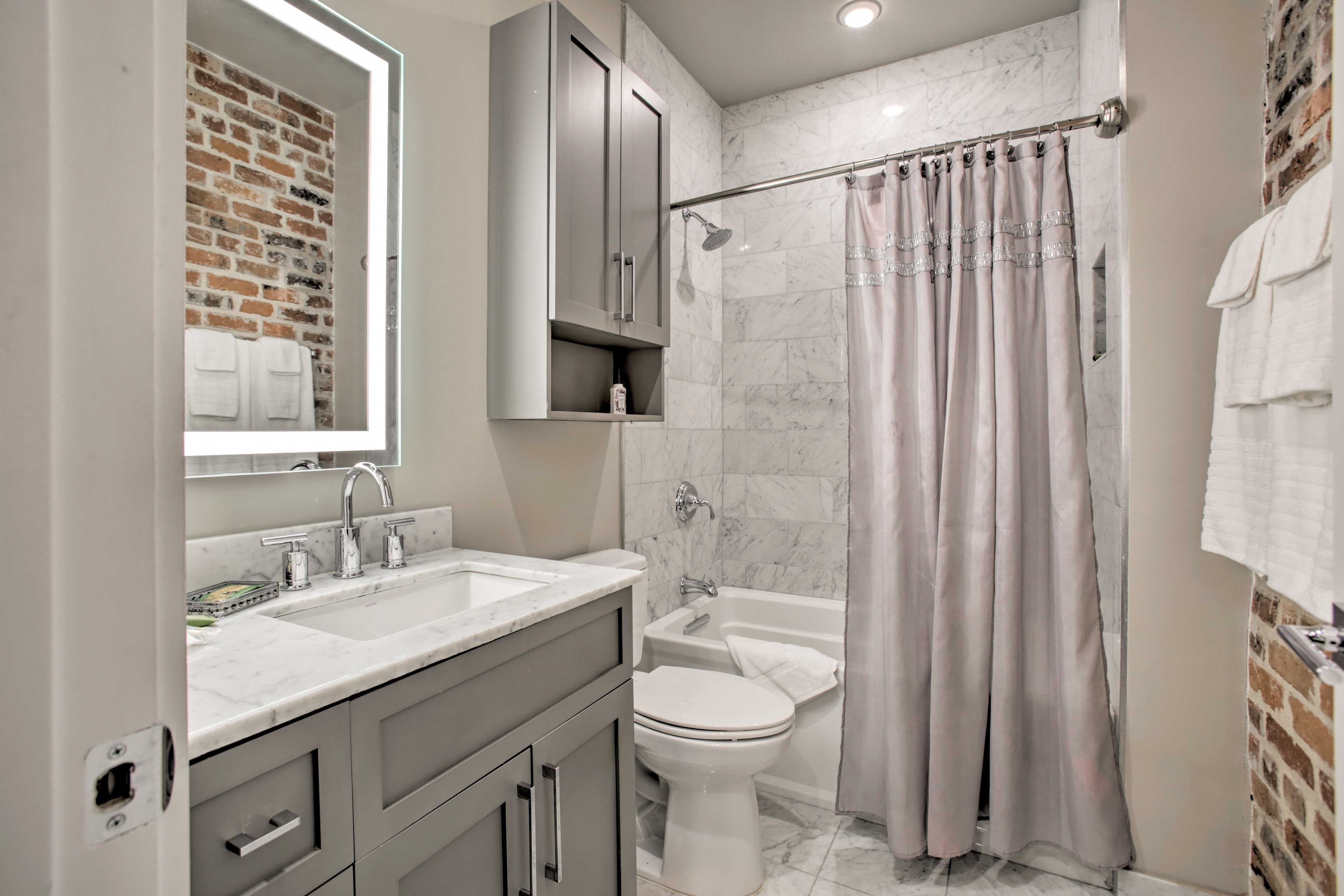 The en-suite bathroom has a shower/tub combo.