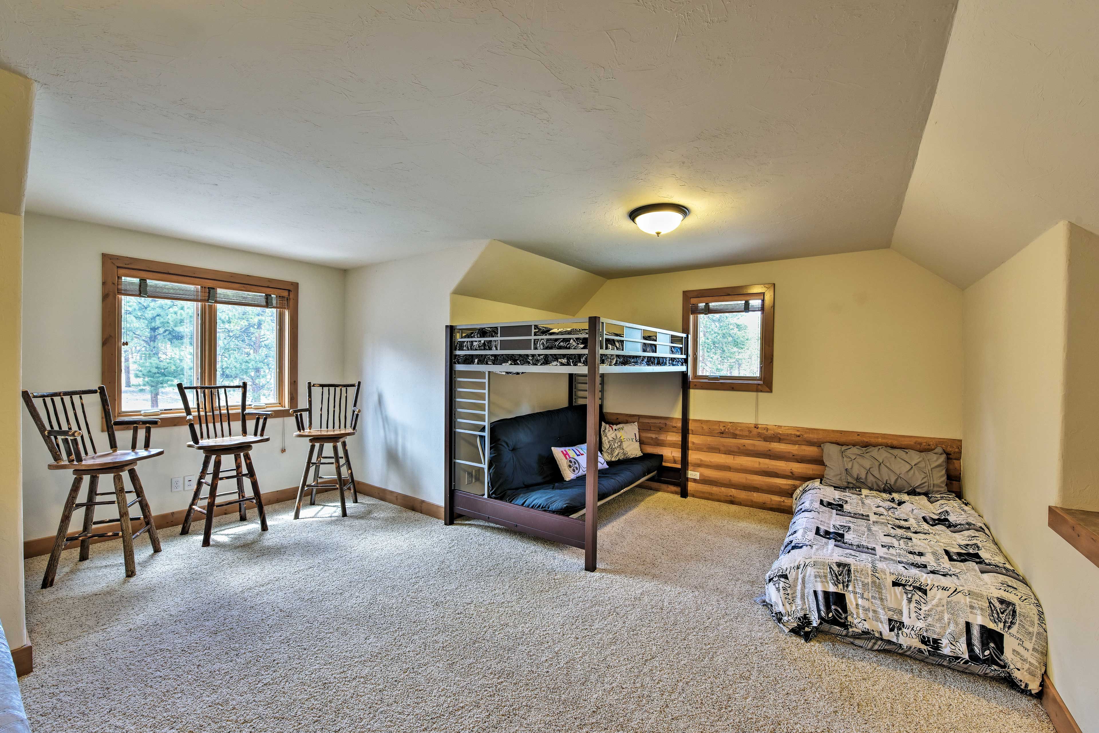 The kids can claim this room with a bunk bed, queen bed, and full bed.
