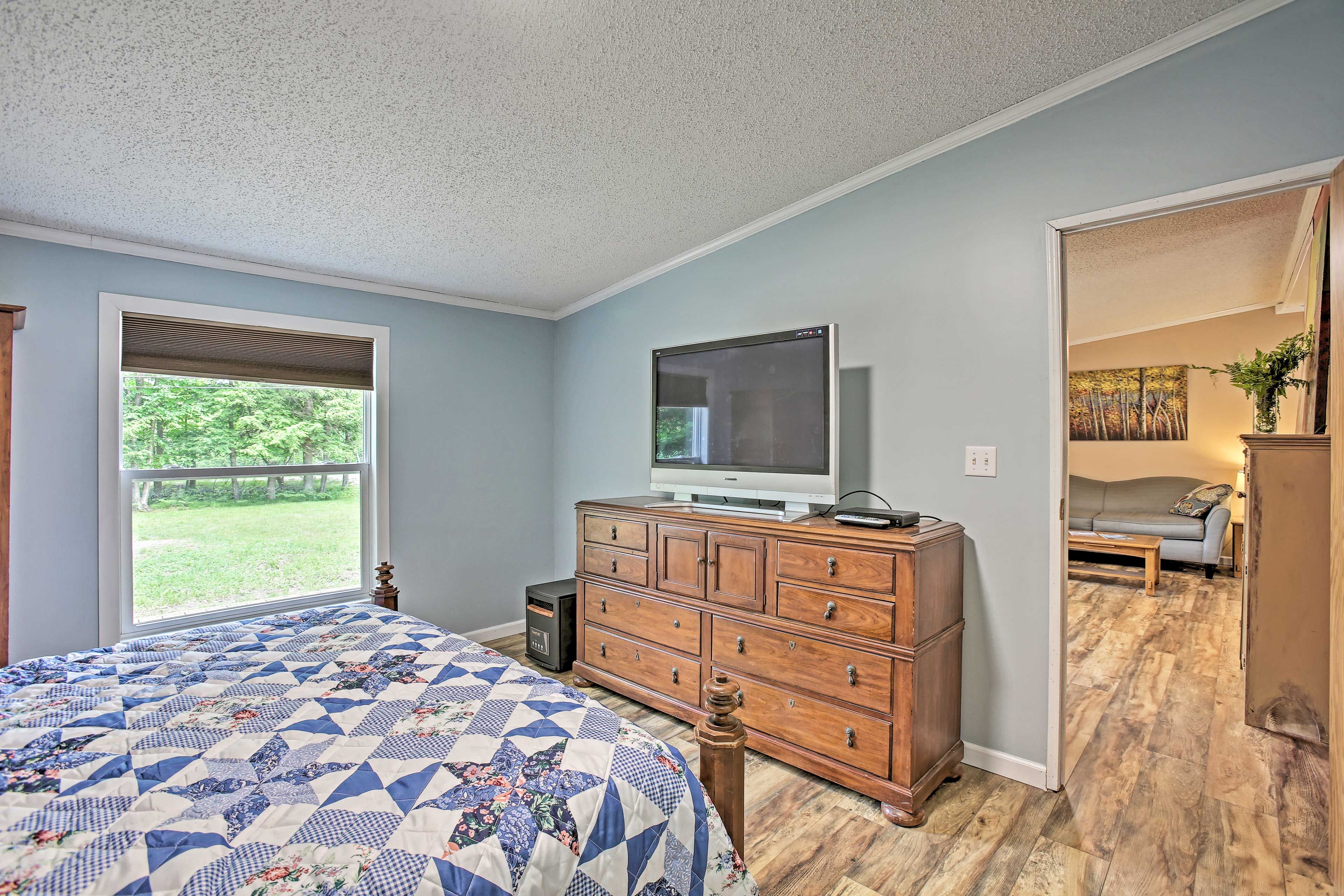 Drift to sleep to the sound of movies playing on the flat-screen cable TV.