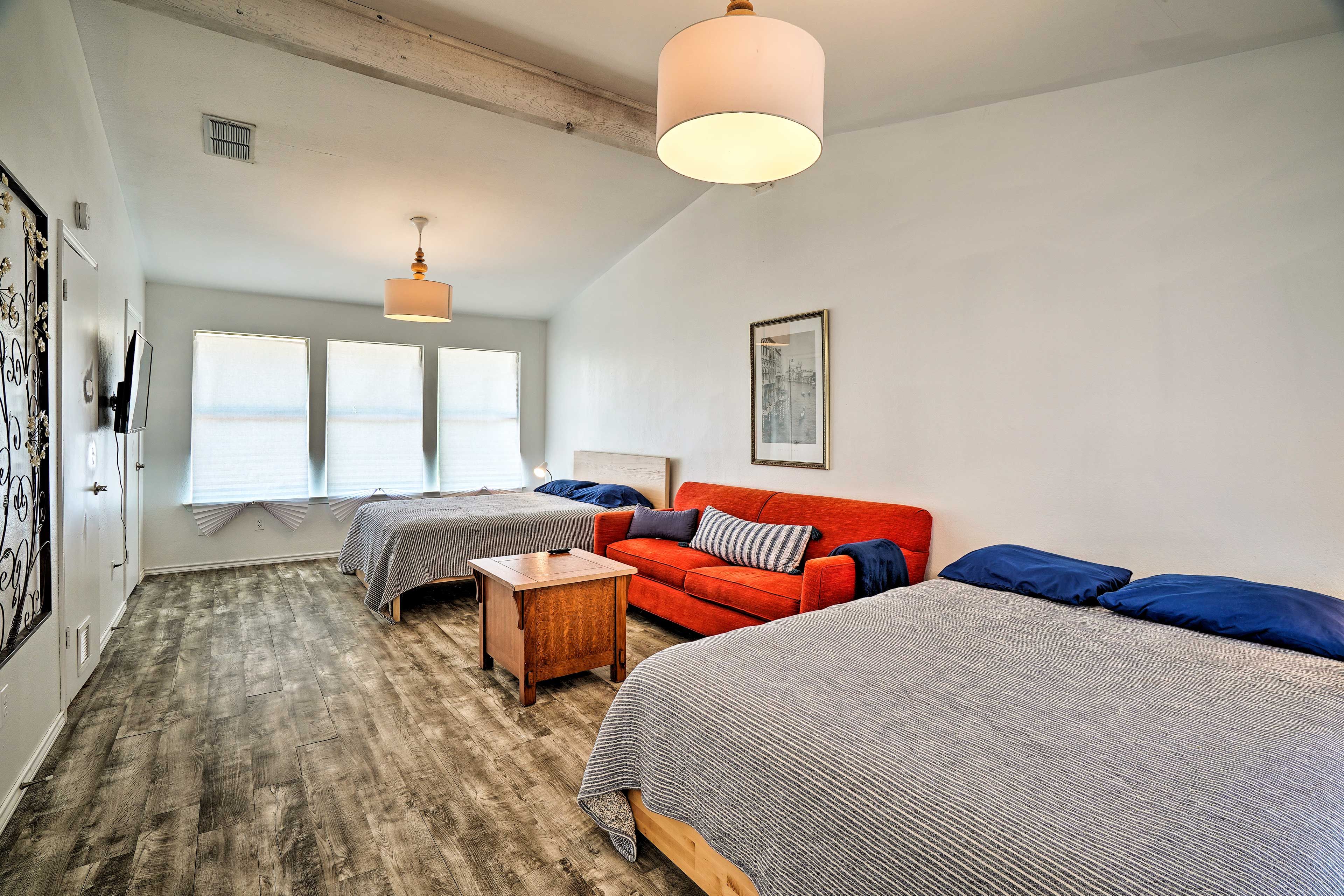 Head to the bedroom and sink into the 2 snug queen-sized beds!