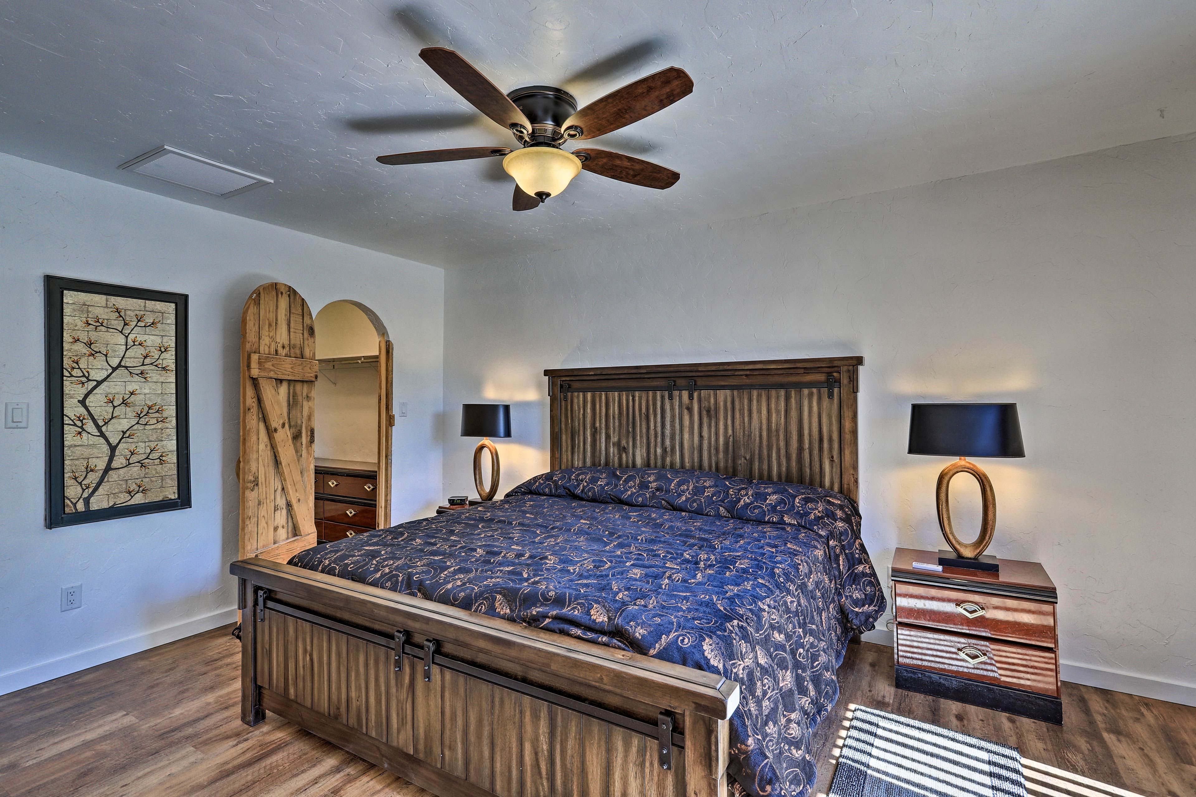 Bedroom highlights include a flat-screen TV, ceiling fan & patio access!