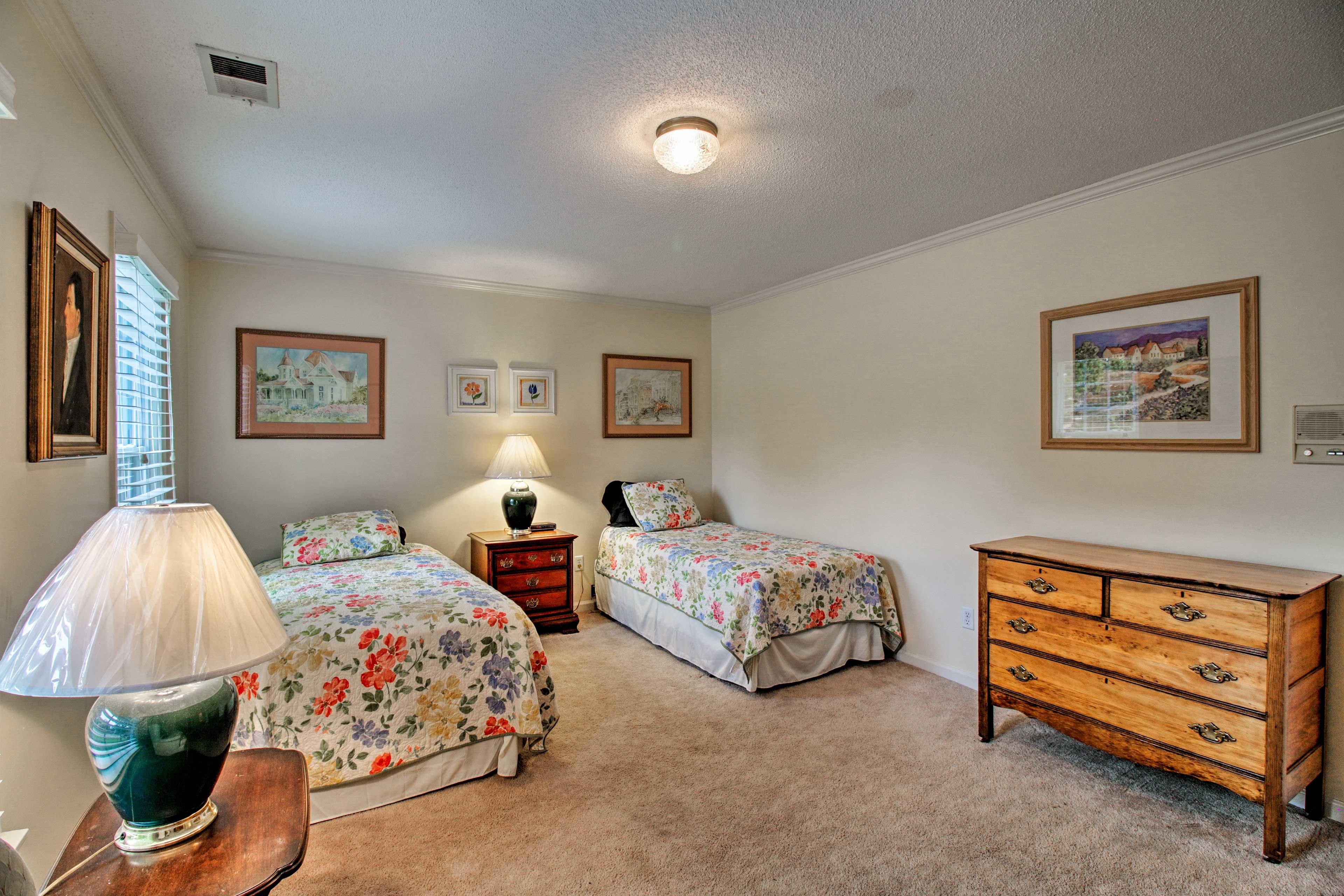 Your kids can make this twin bedroom their home.