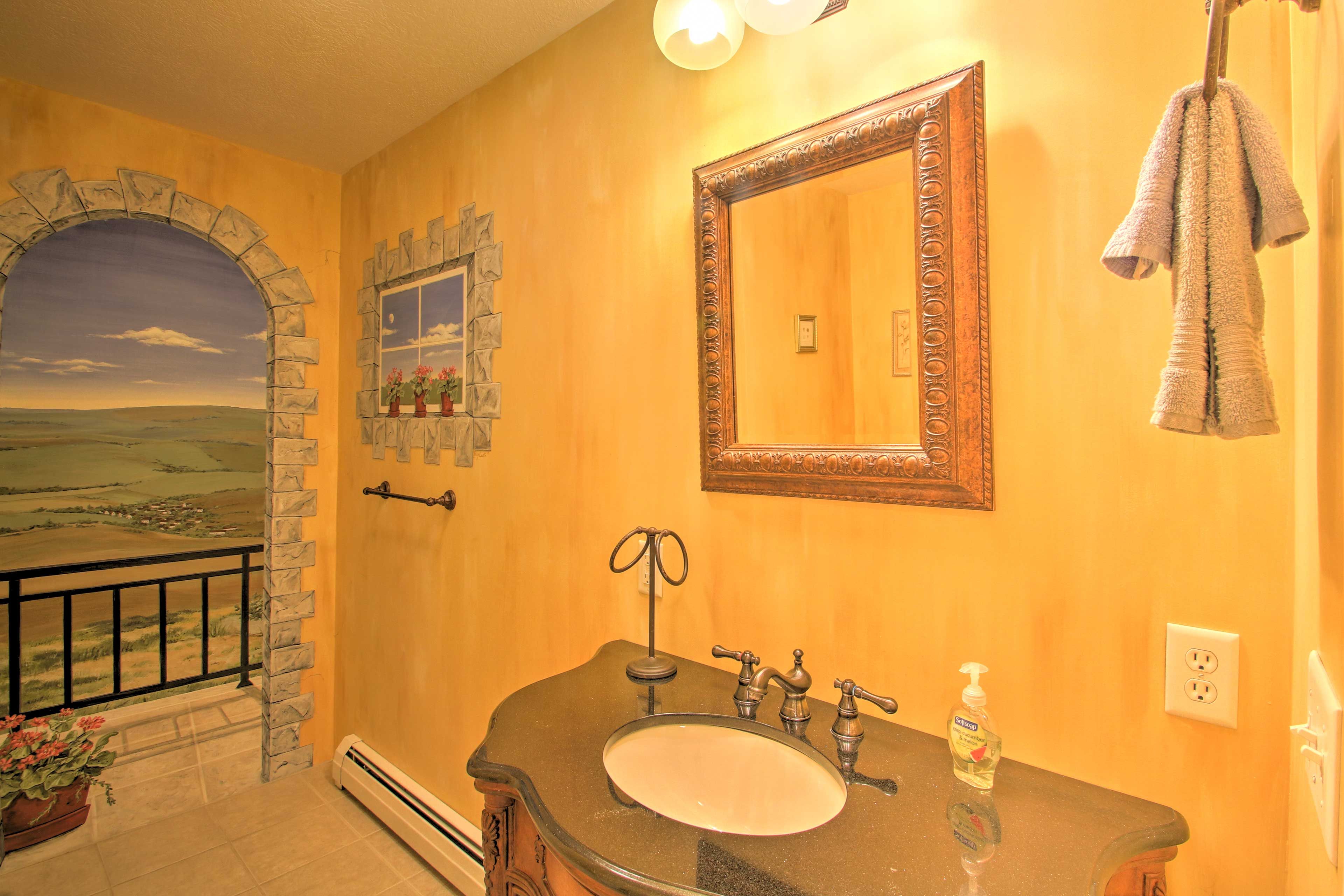 Dream of rolling hills while you freshen up in this bathroom.
