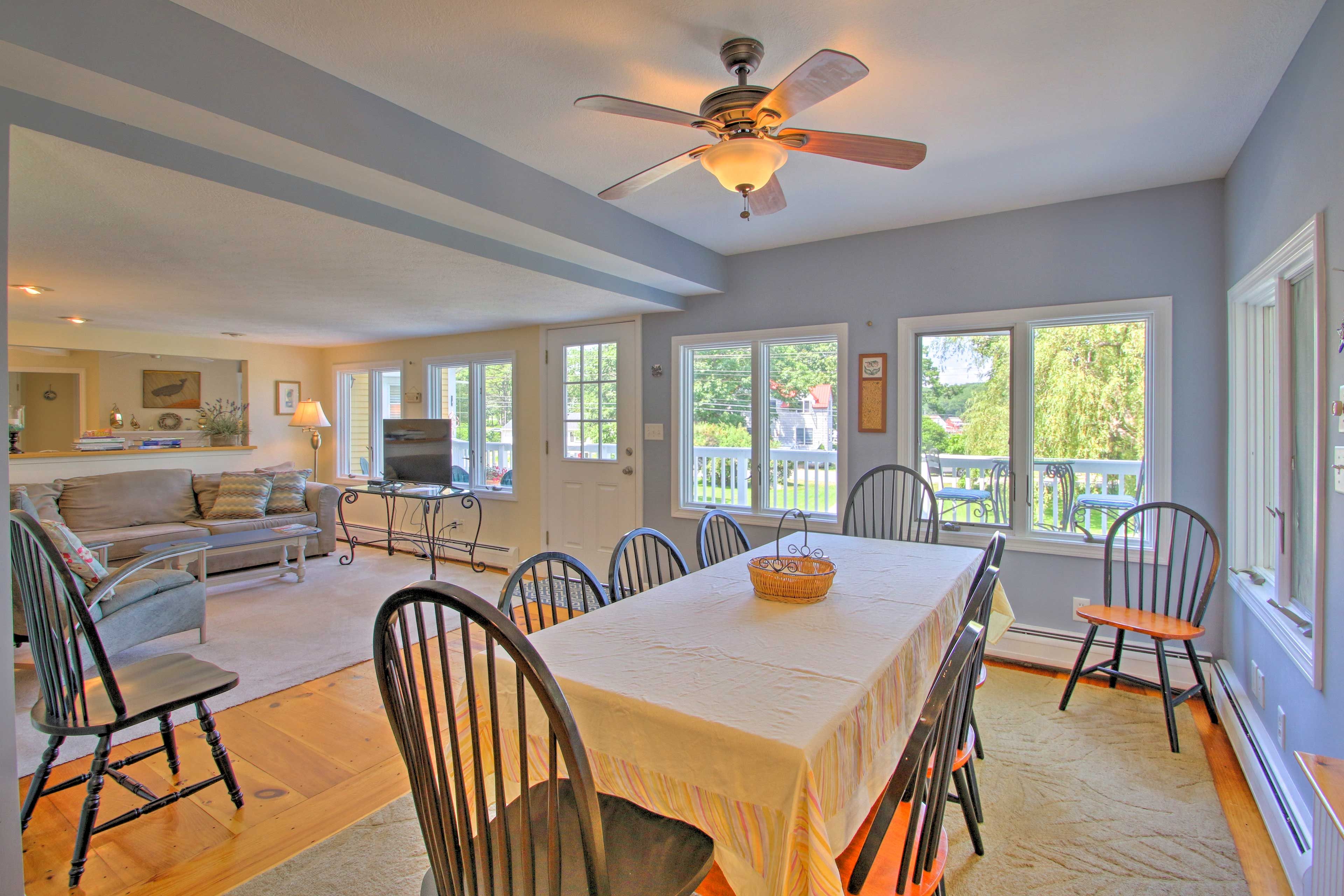 Dine together around the large table with views of the yard.