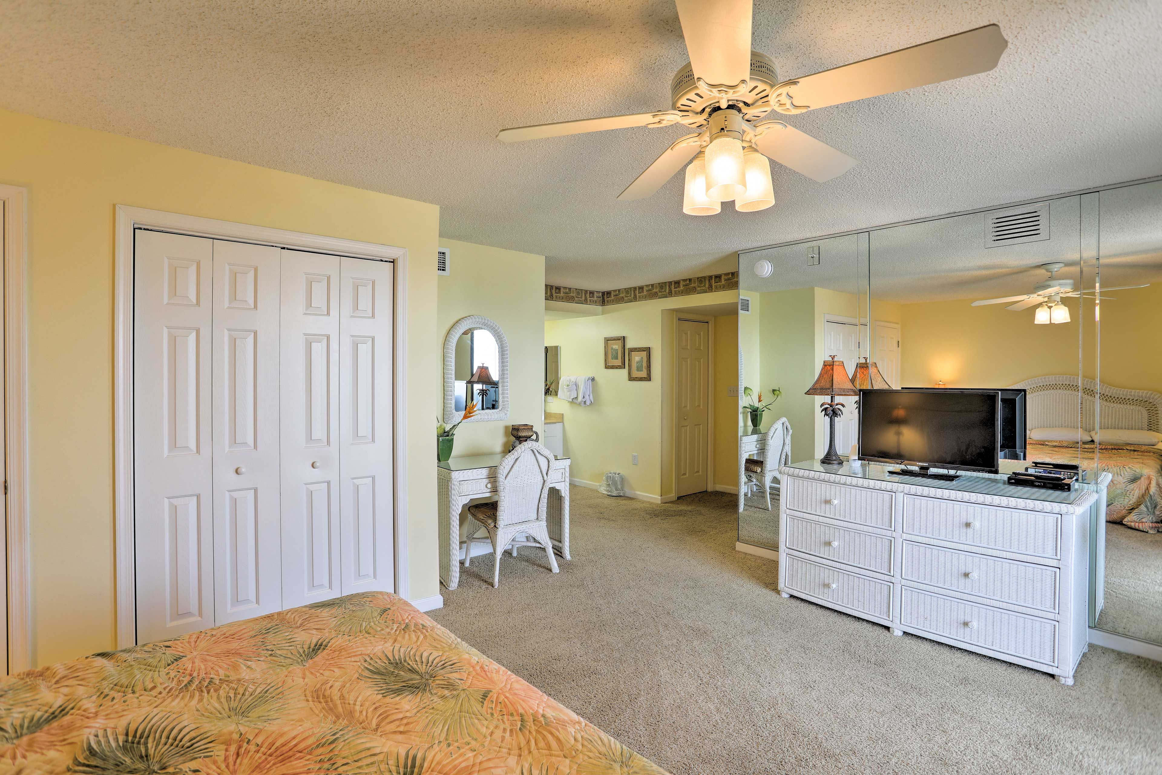 This bedroom is complete with flat-screen TV, ceiling fan, and en-suite bath.