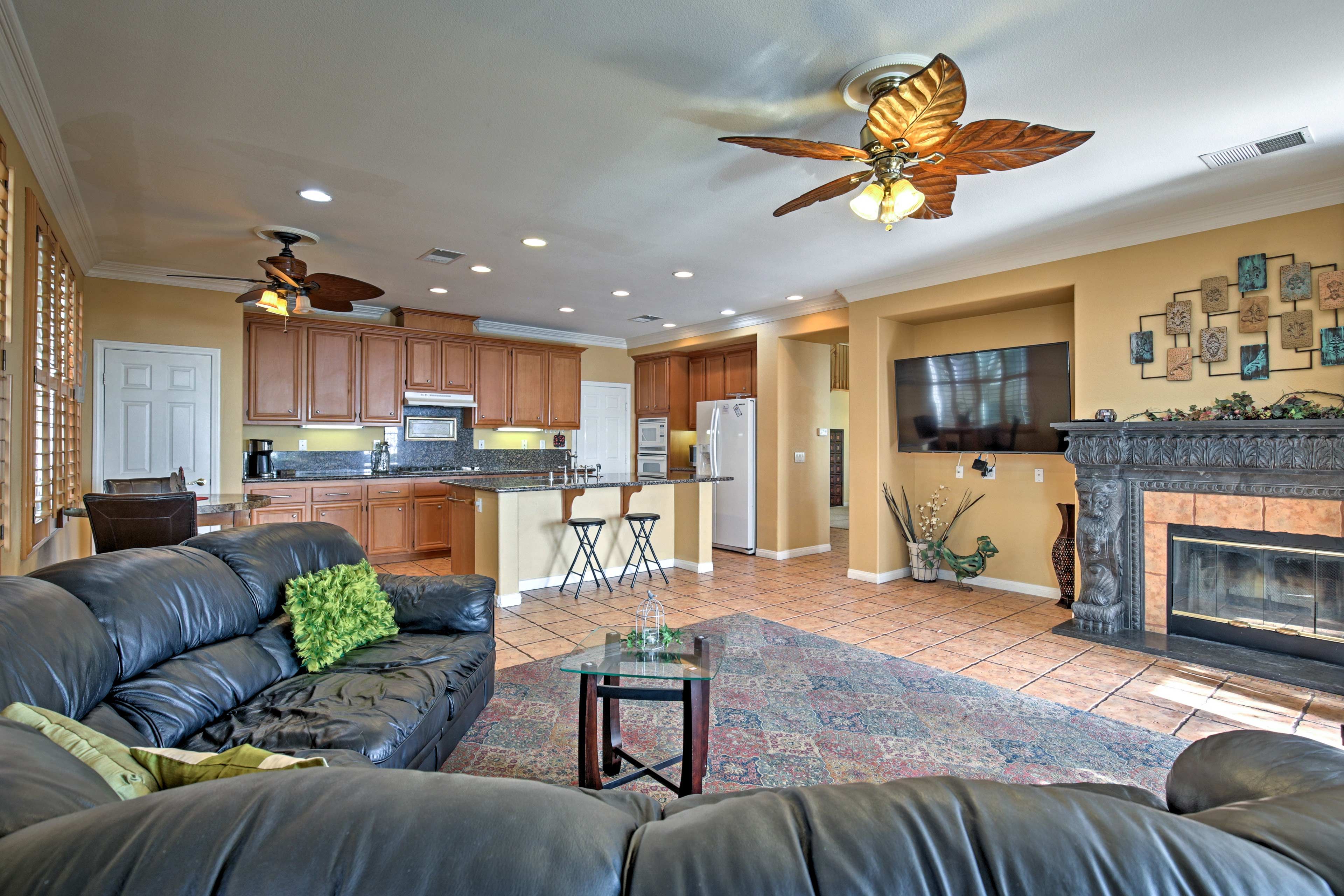 Get comfortable on the couch an watch a movie on the 65-inch TV.