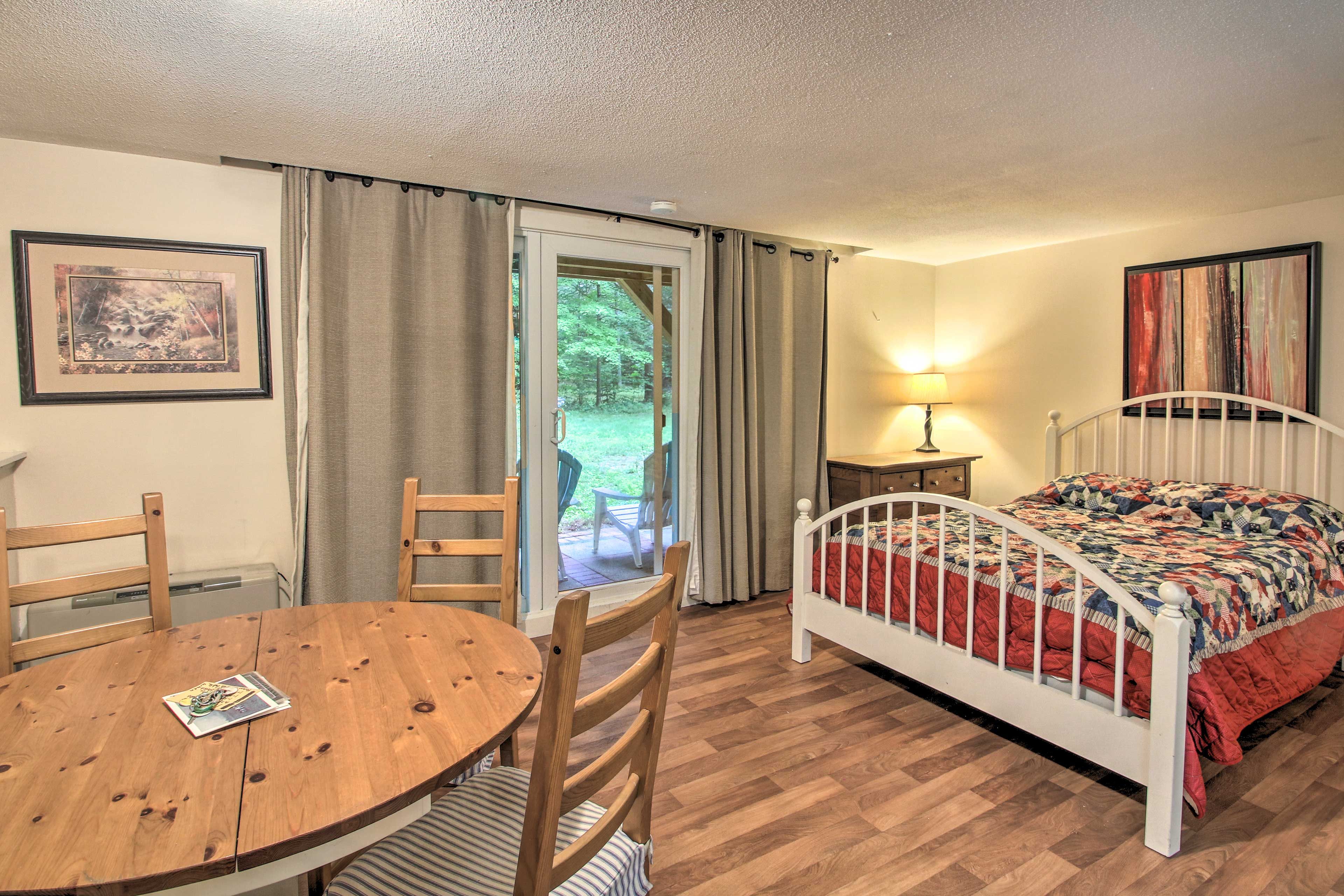 The studio features a queen bed.
