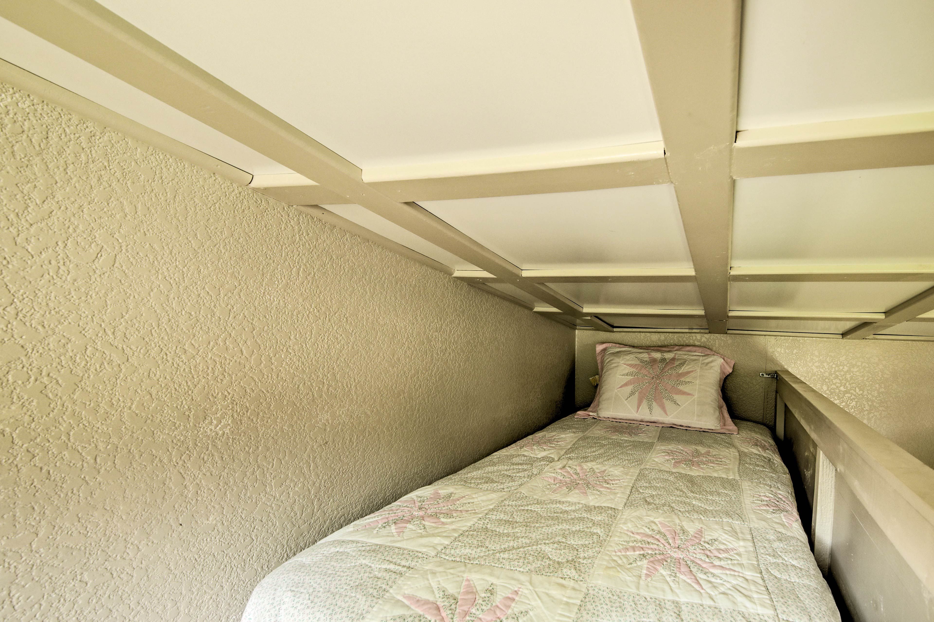 Head up to the loft where you'll find a another bed.