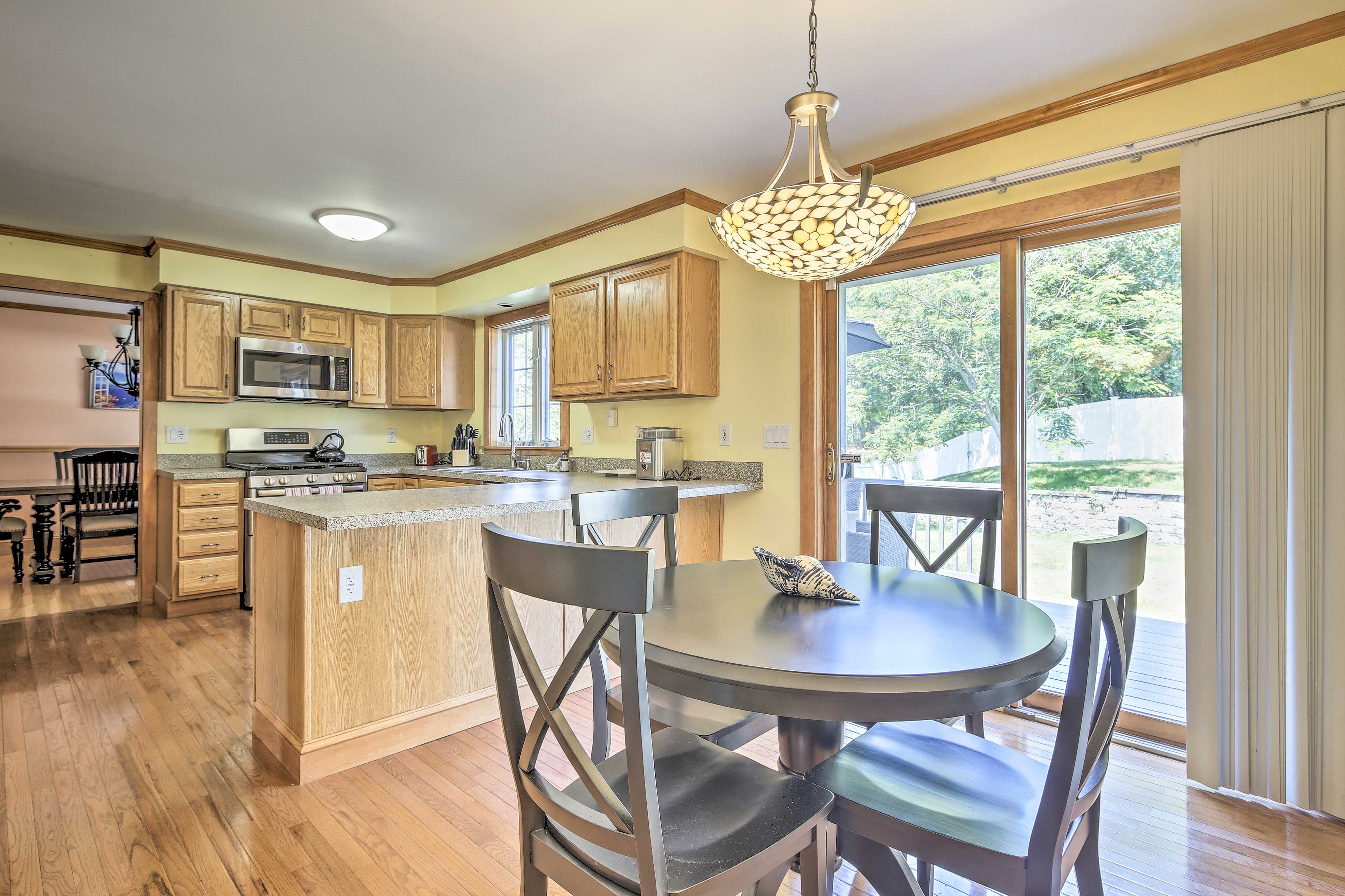 The kitchen and deck await just beside the cooking and dining spaces.