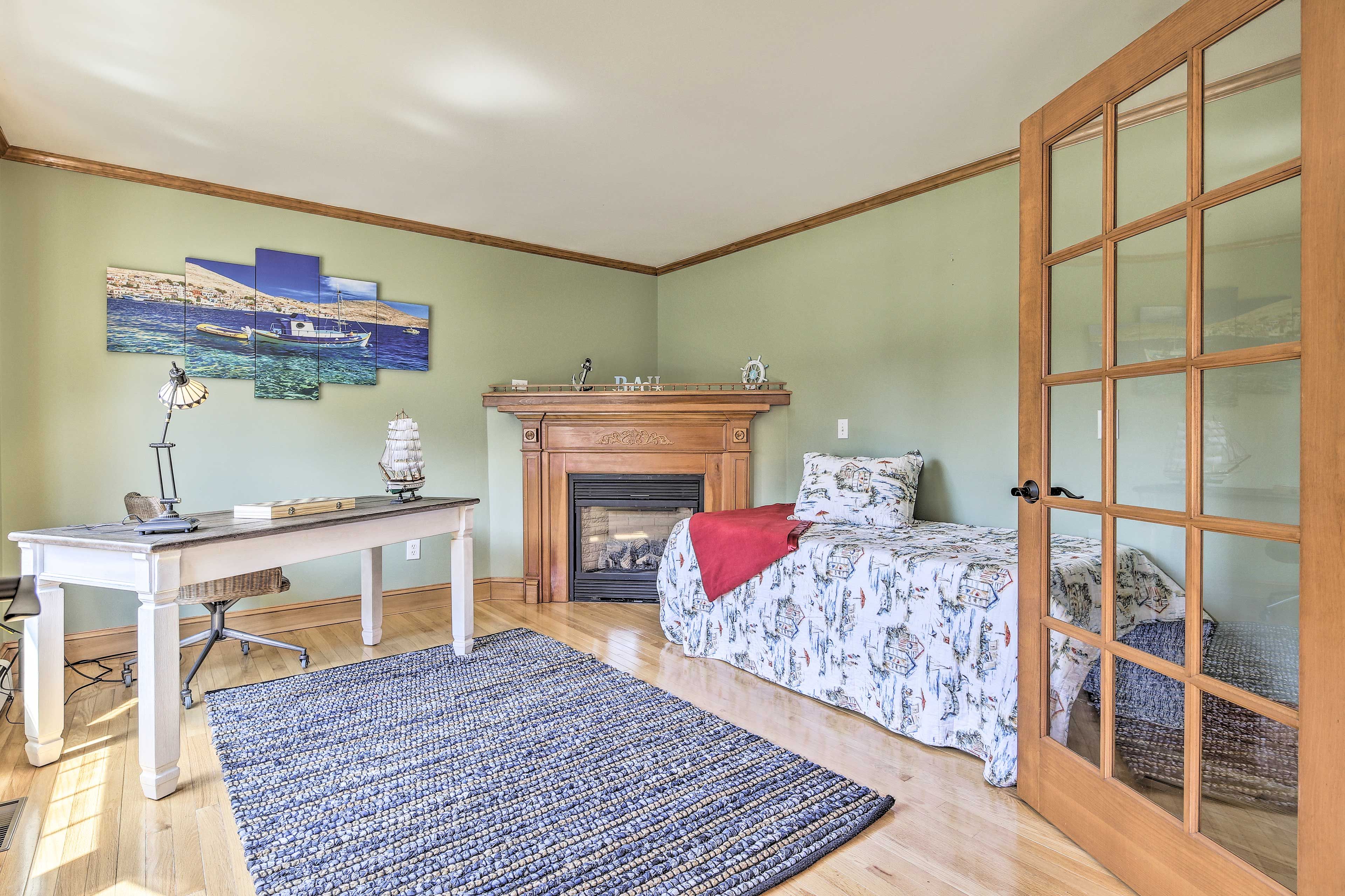 This bedroom boasts a laptop-friendly desk and a twin bed.