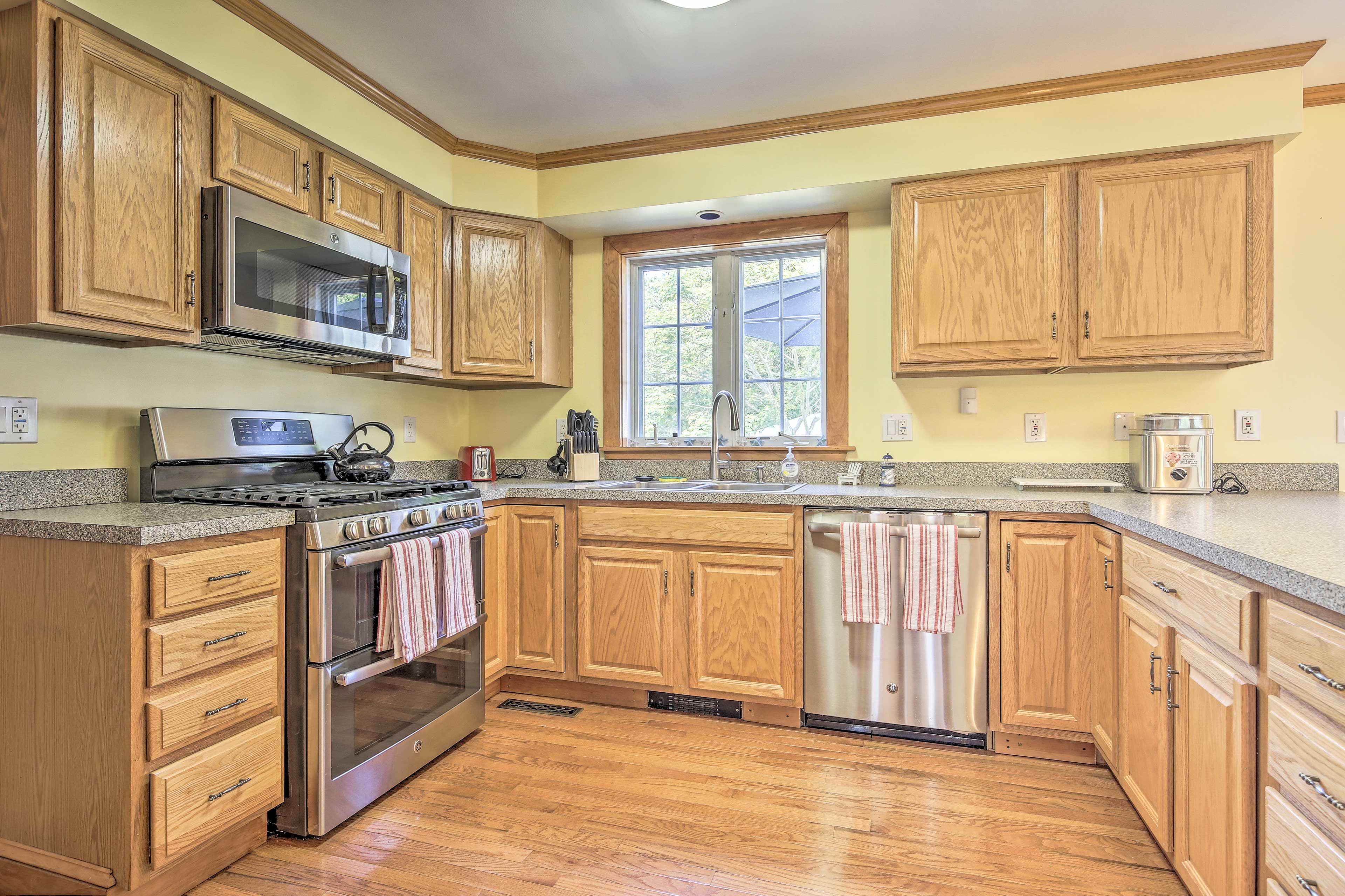 The kitchen is fully equipped, boasting stainless steel appliances.