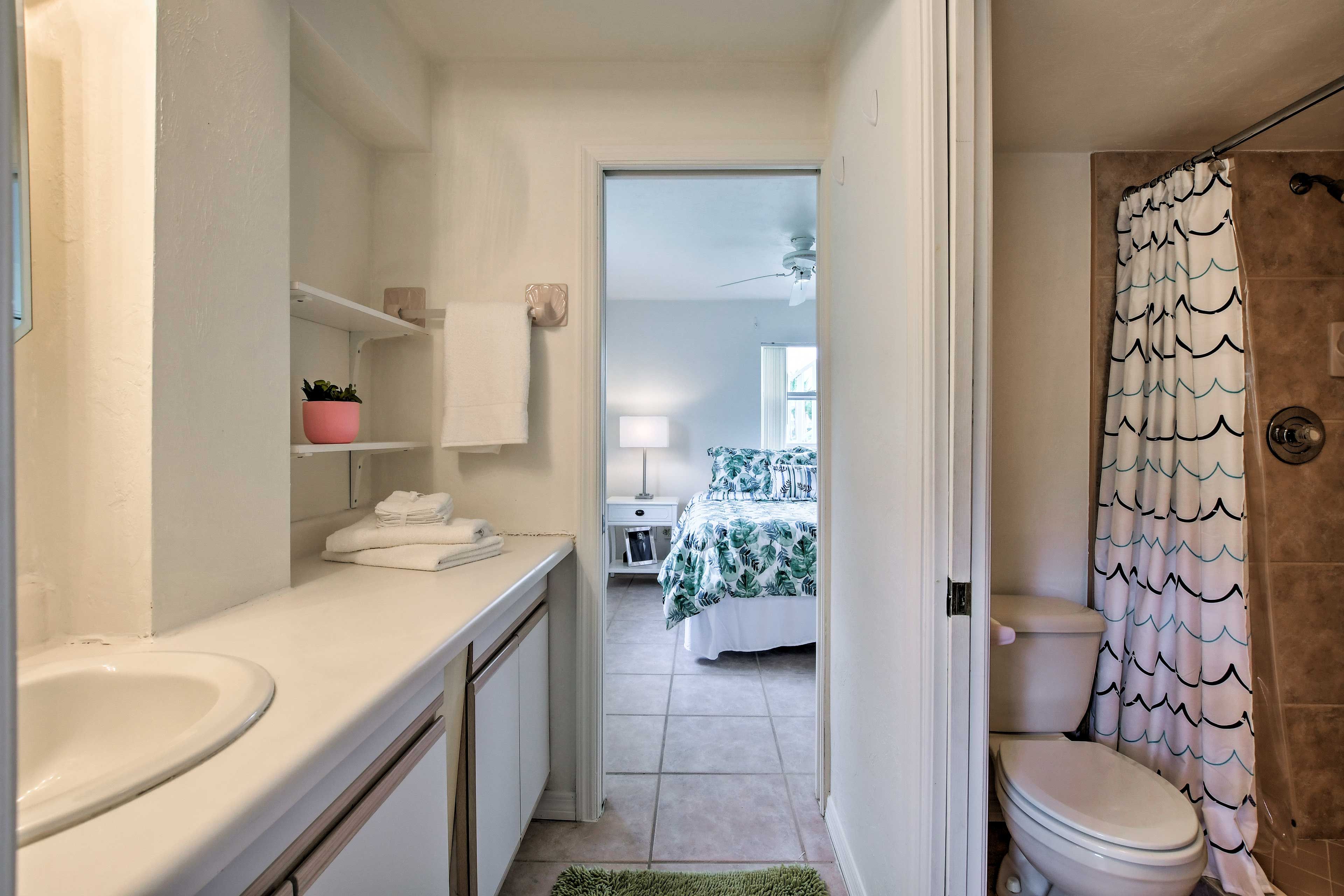 Fresh towels are provided in the bathroom.