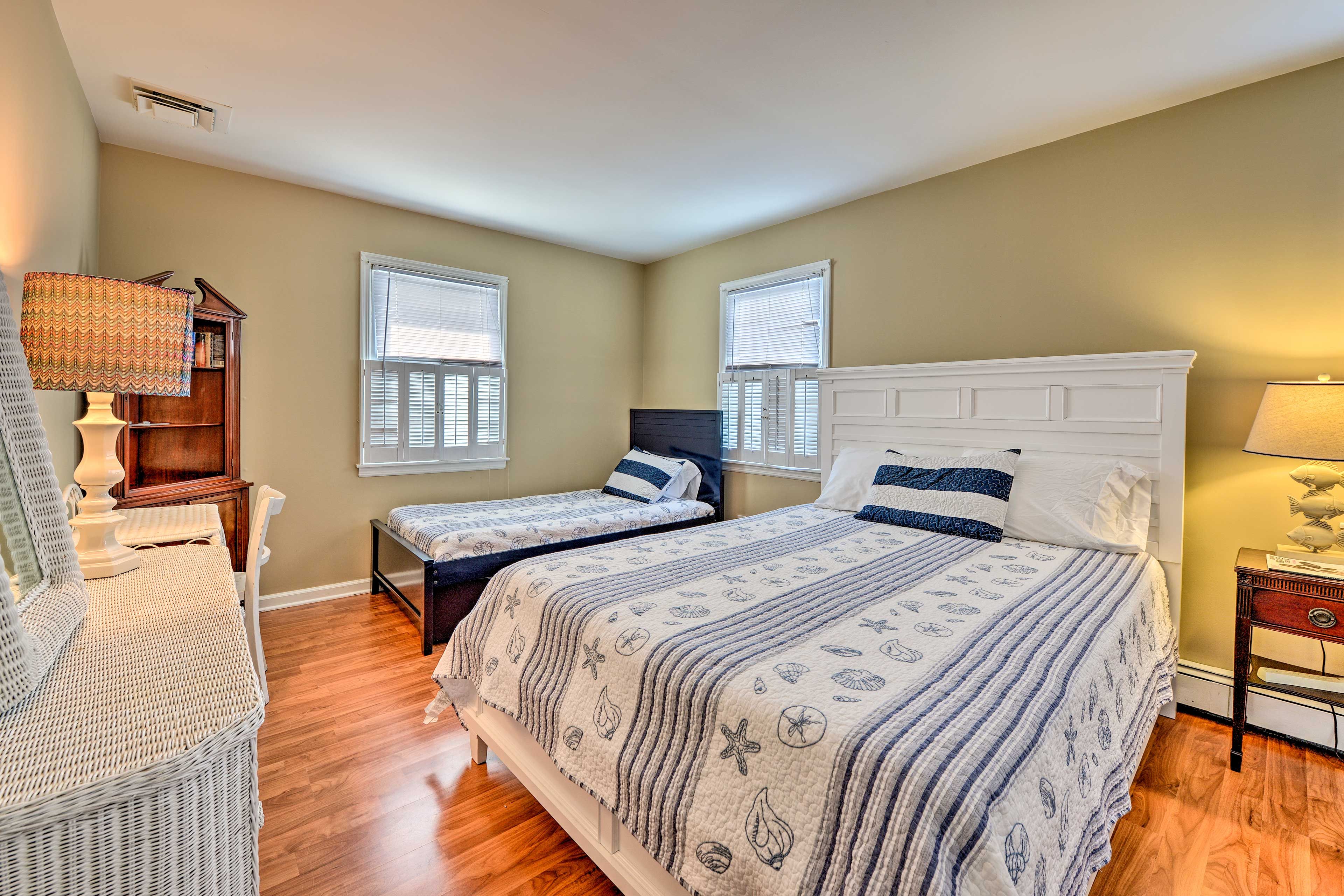 The room boasts a queen bed and 2 twin beds with 2 twin trundles.