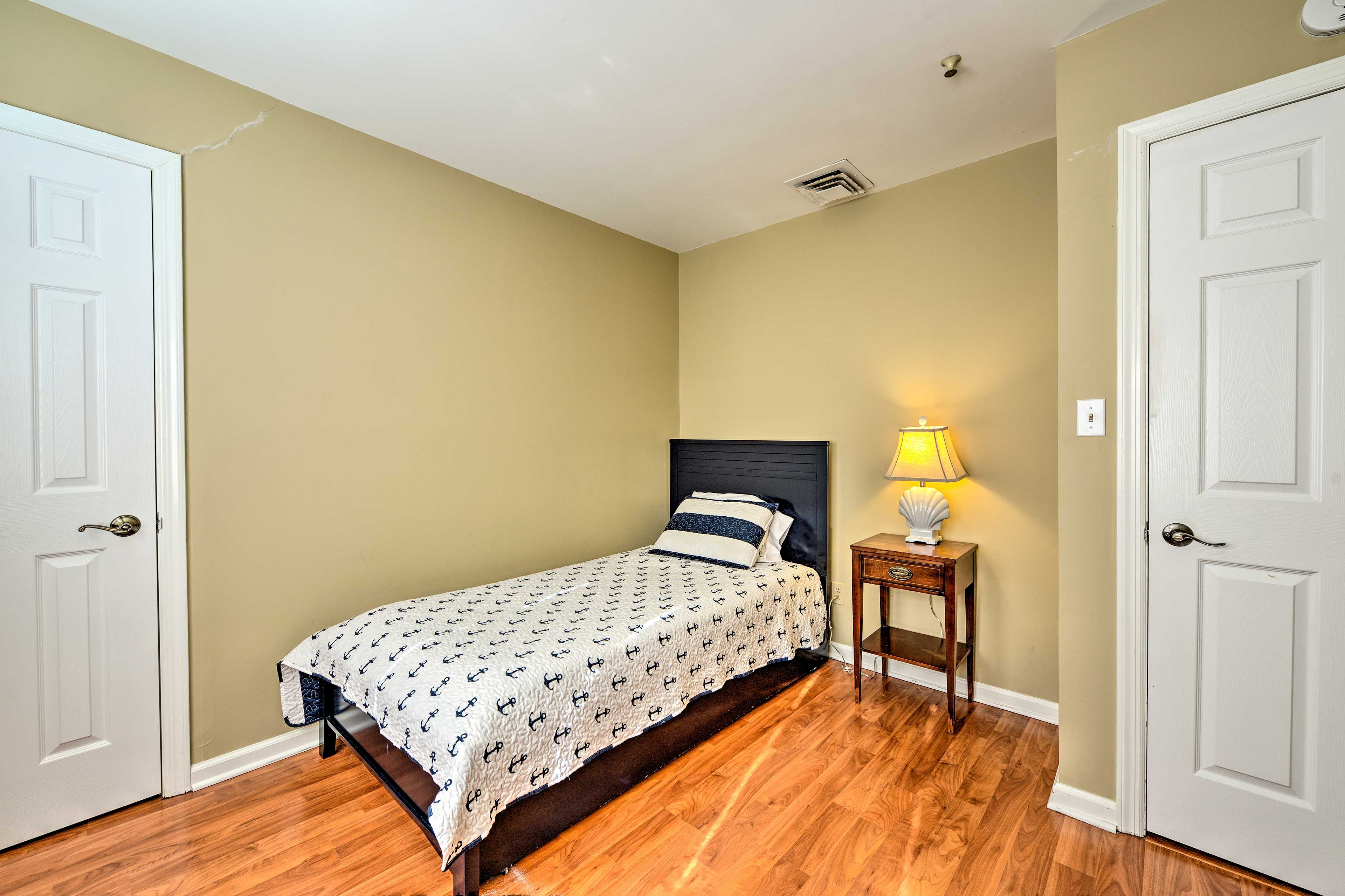 This bedroom features a twin bed with a twin trundle.