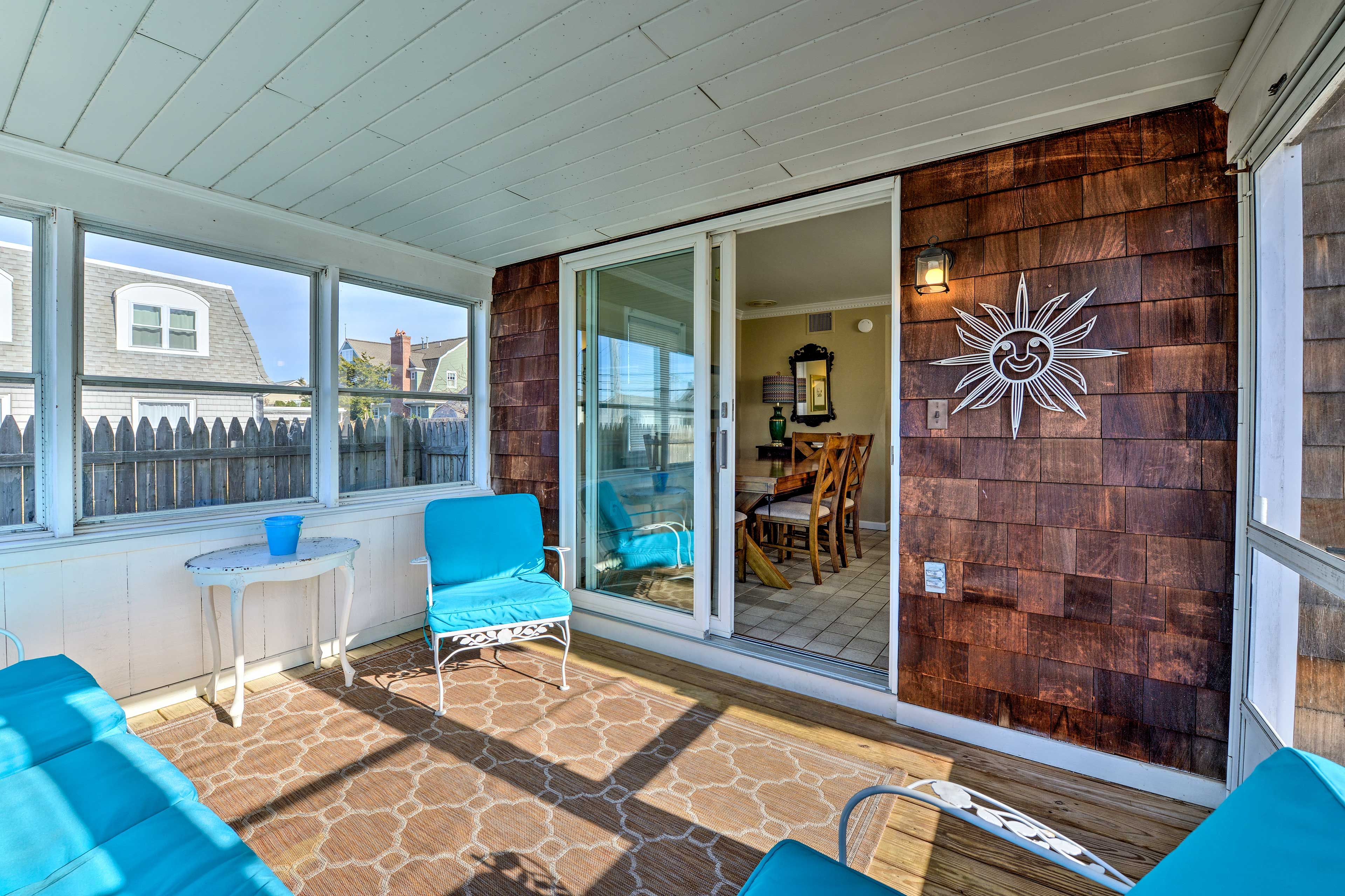 Step out onto the screened-in porch.