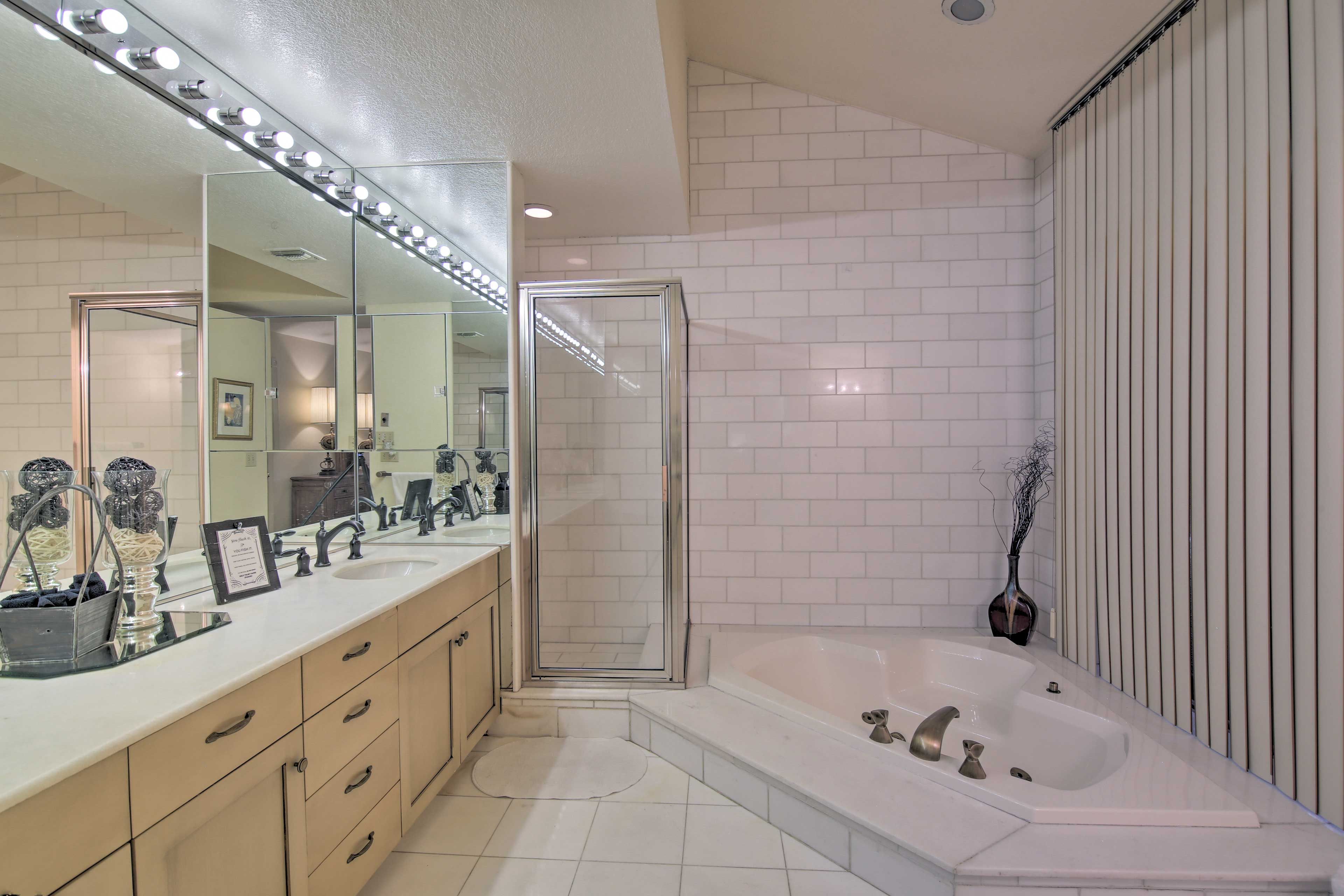 The en-suite bathroom has a walk-in shower and soaking tub.
