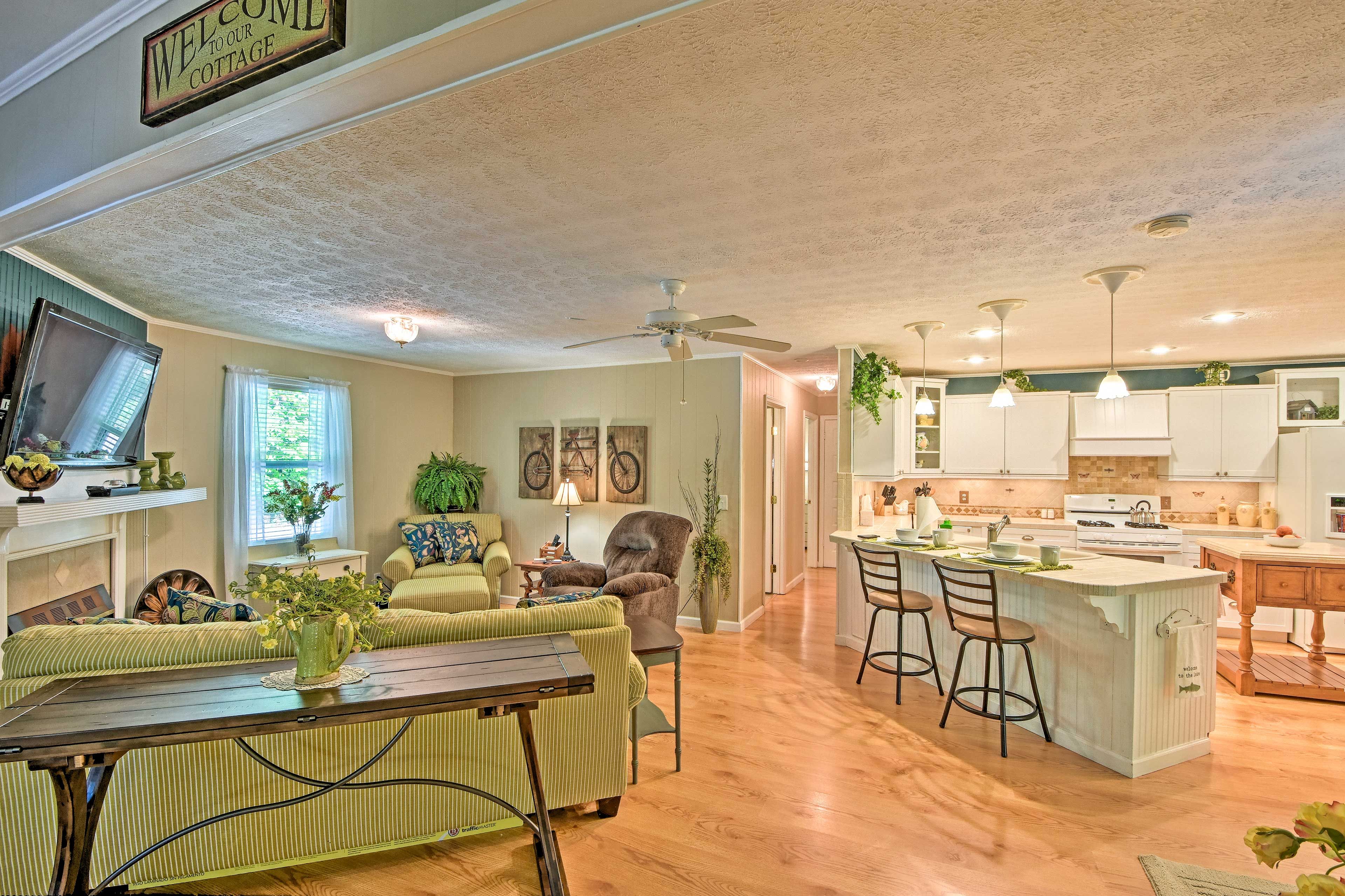 The interior boasts an open floor plan with hardwood floors.