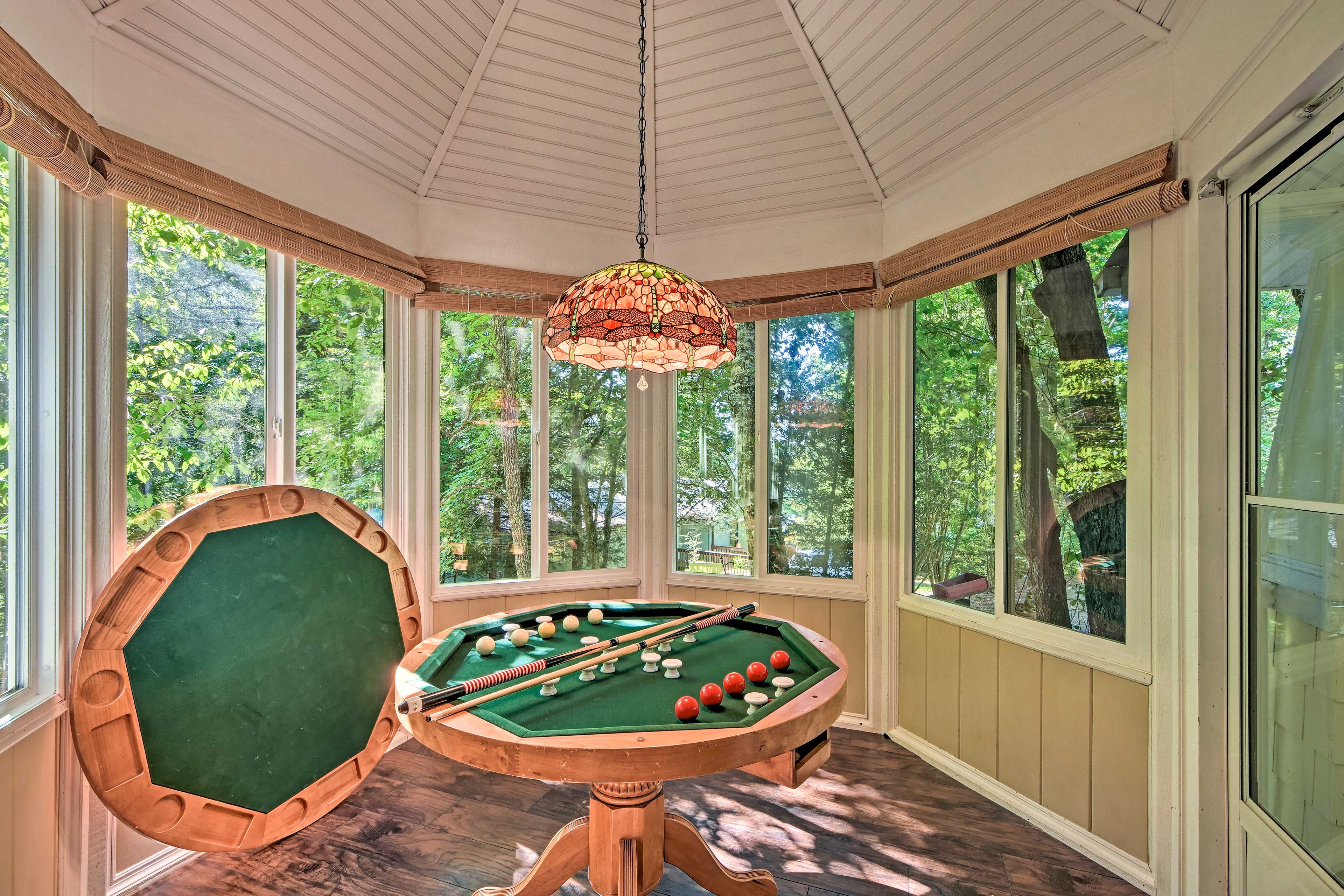 The kitchen table can convert to a bumper pool table.