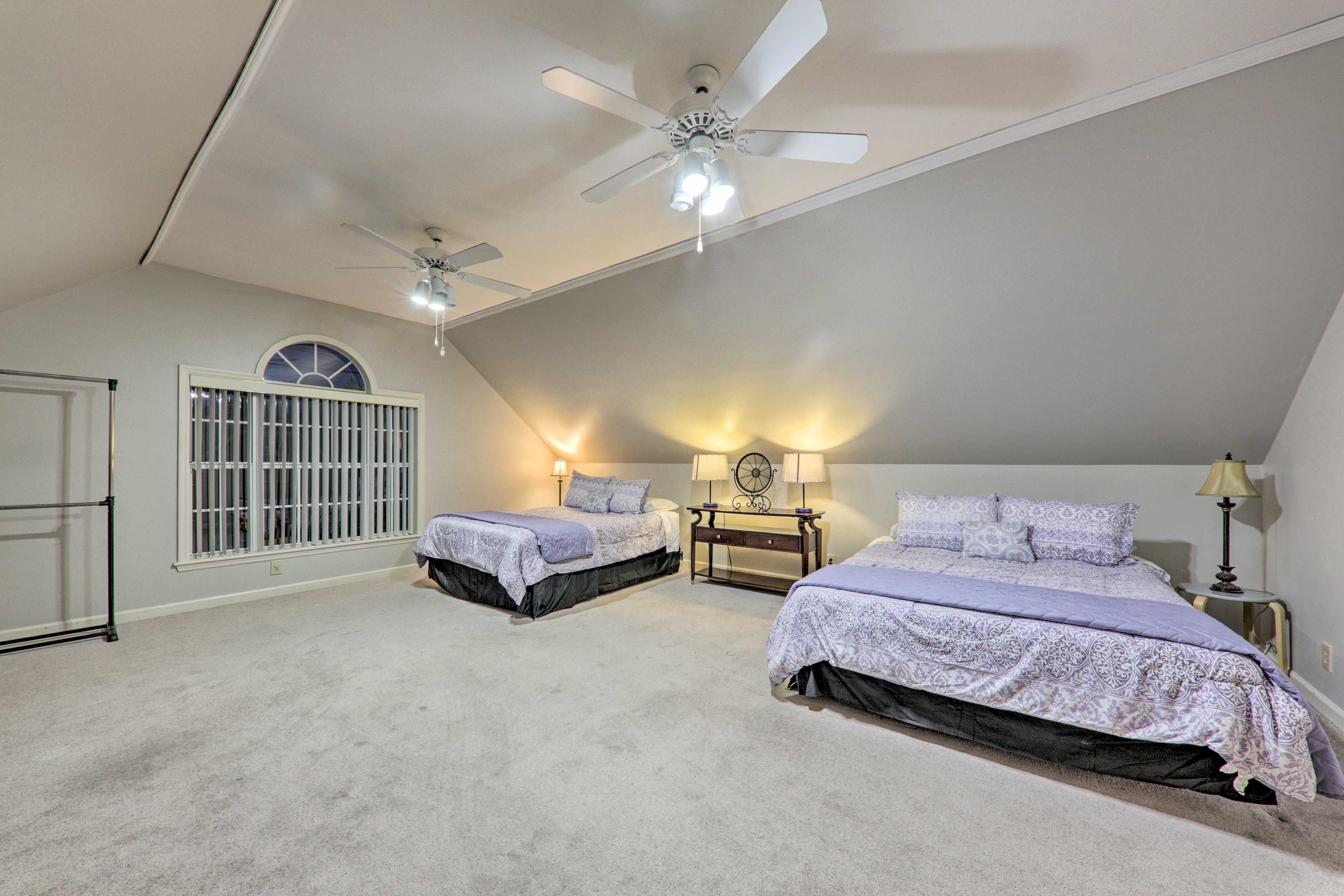 You'll find a set of queen beds in this room.