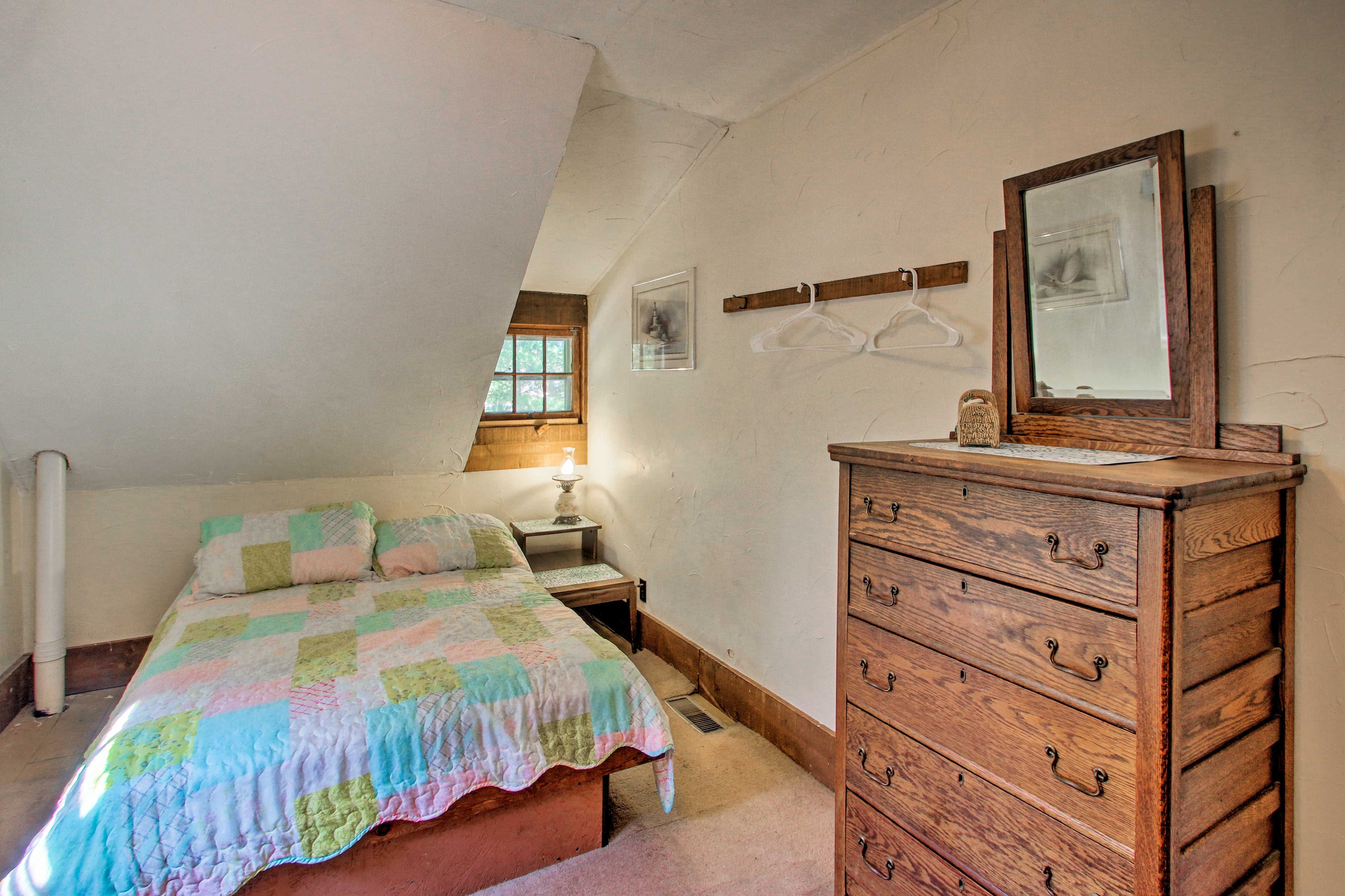 Curl up under the covers off this full-sized bed in bedroom 3.
