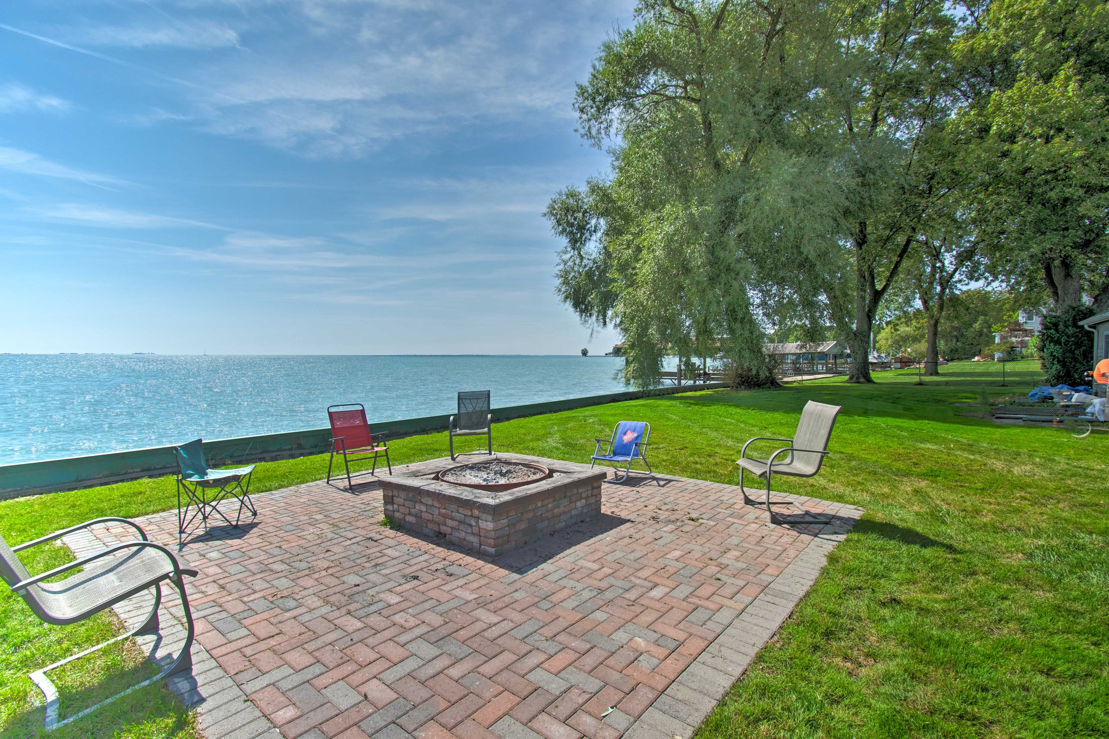 Gather around the fire pit right next to Lake St. Clair!