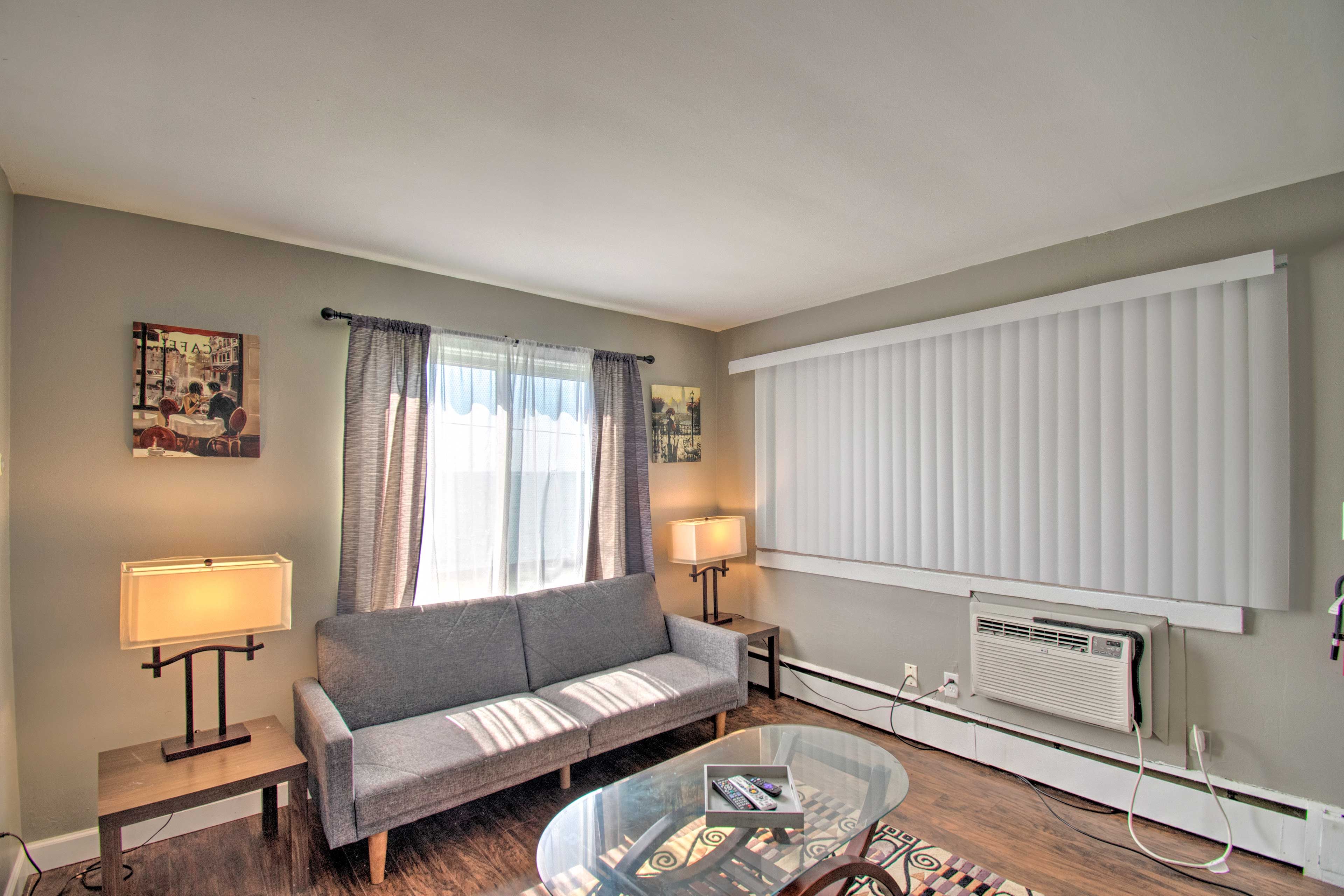 Take a break from the sun and cool off next to the window AC unit.