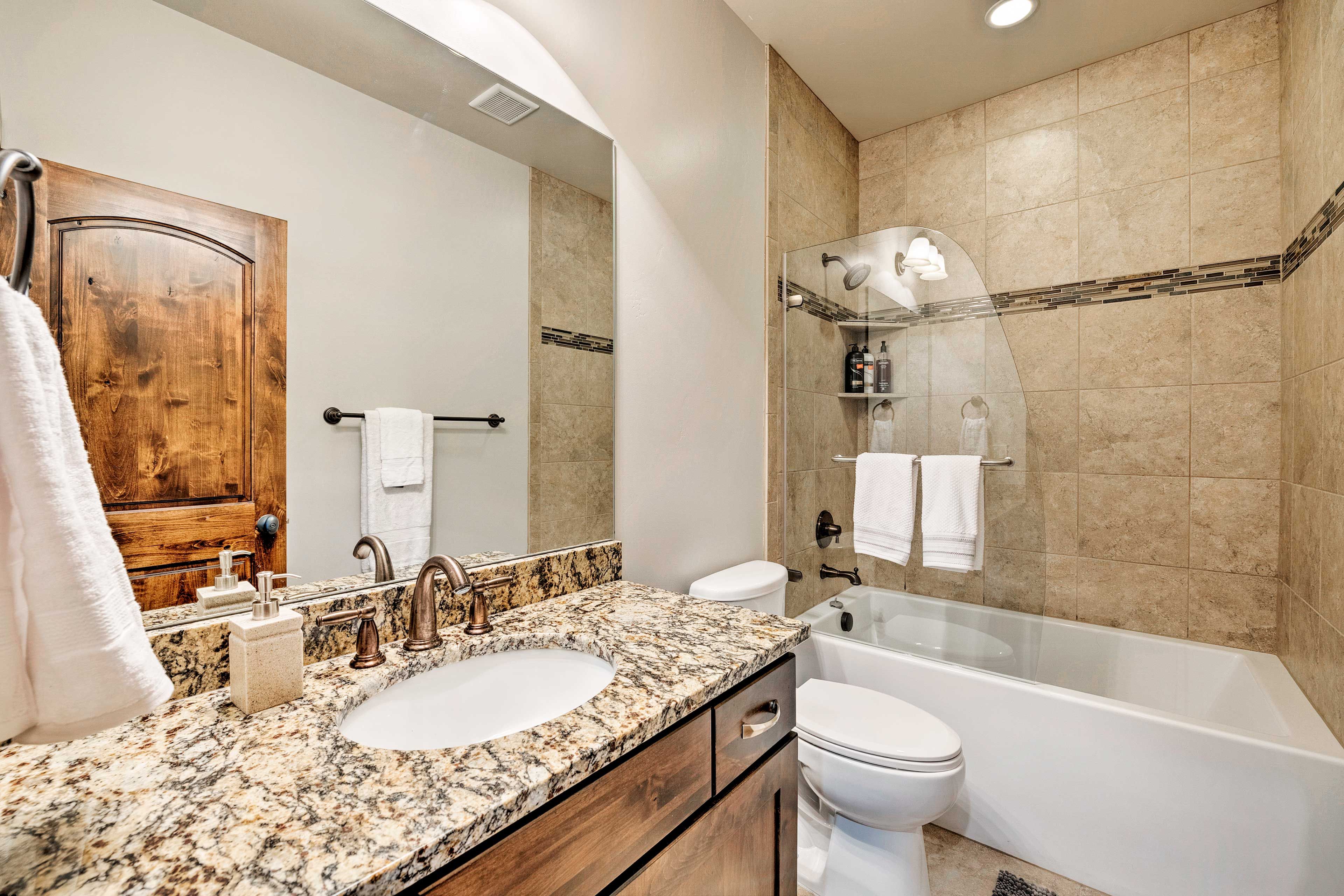 This full bath includes a tub/shower combo.