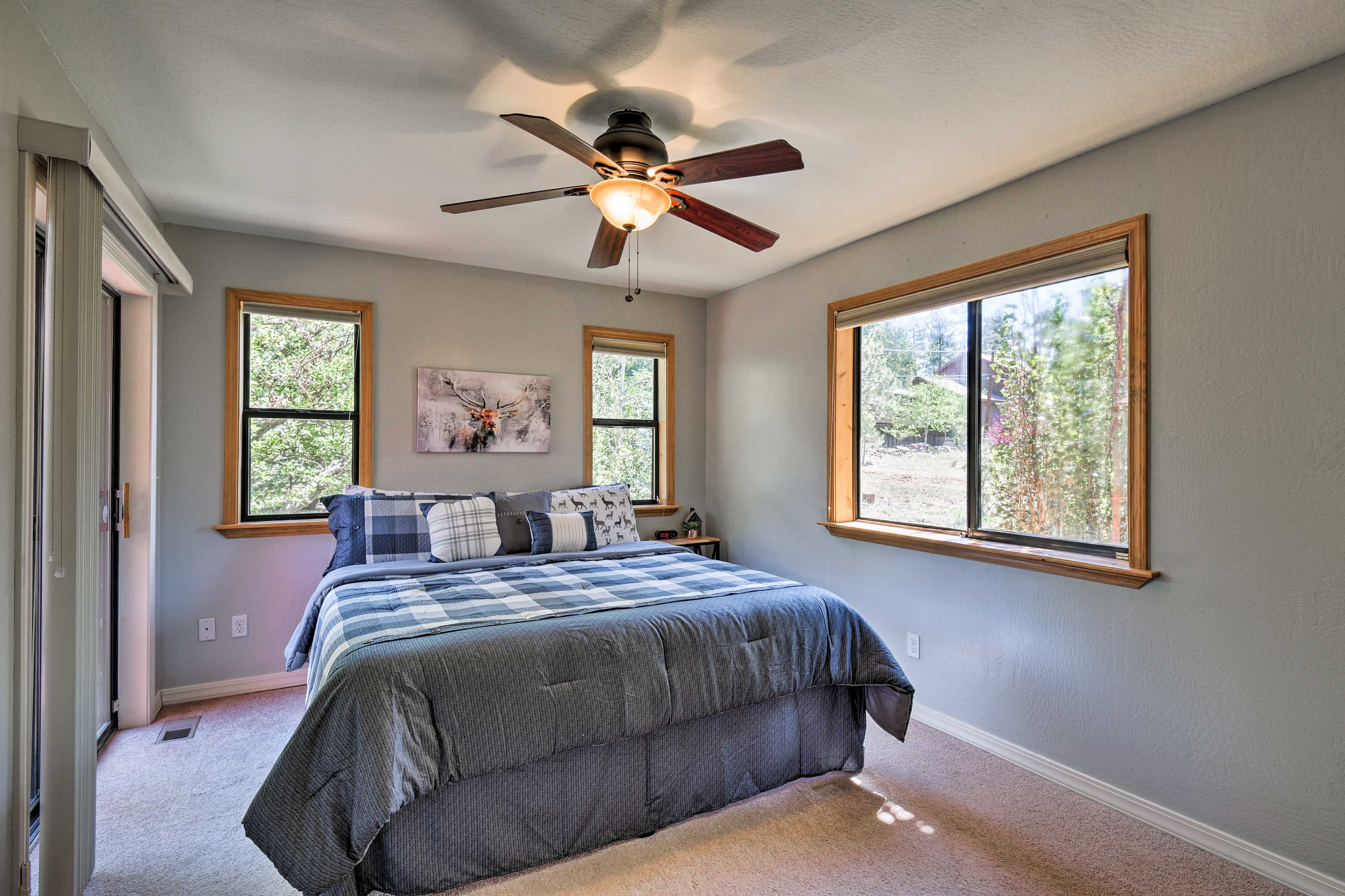 Bedroom 1 | California King Bed | Linens Provided | Patio Access | 1st Floor