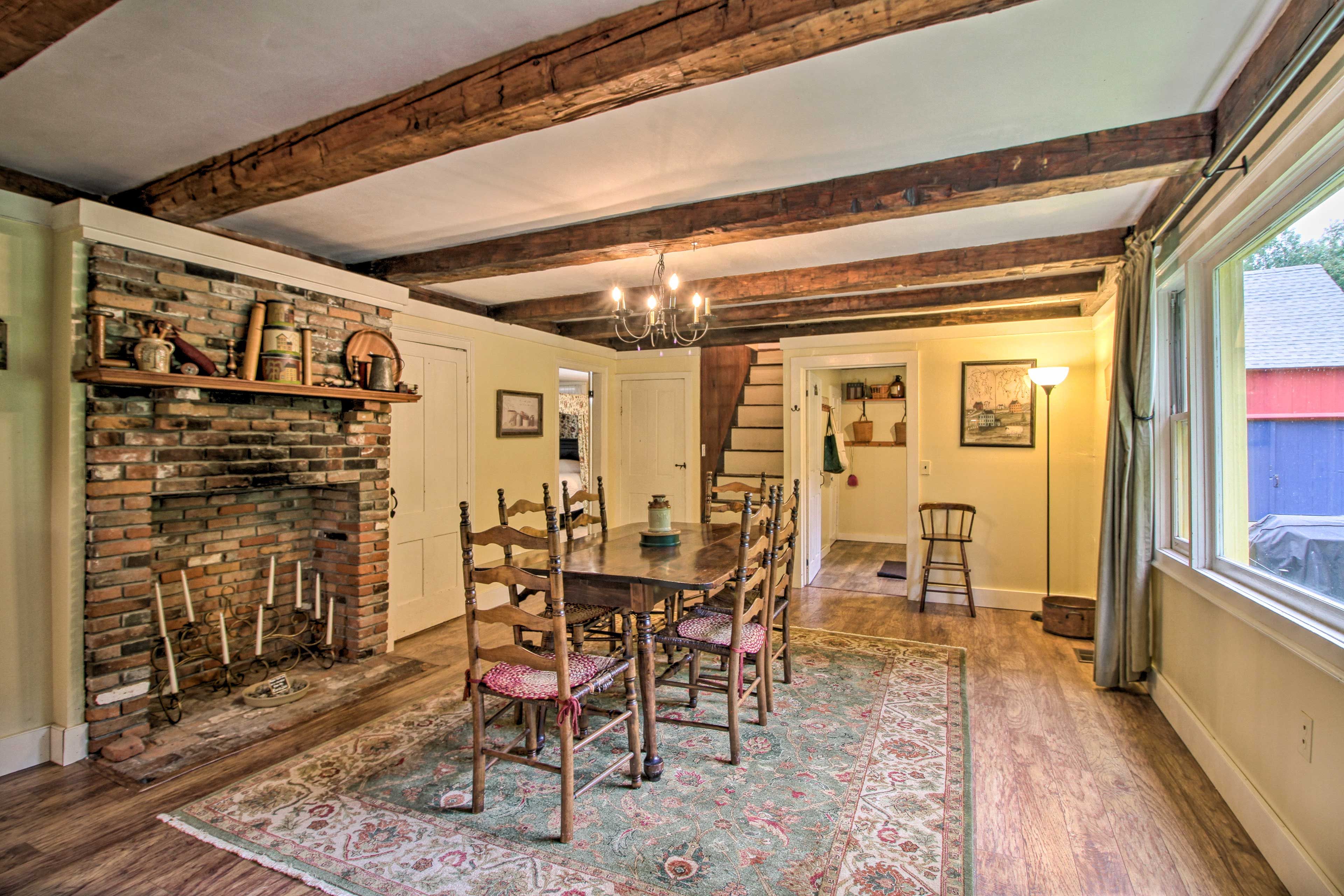 Hand-hewn beams and rustic decor shows off this home's historic character.