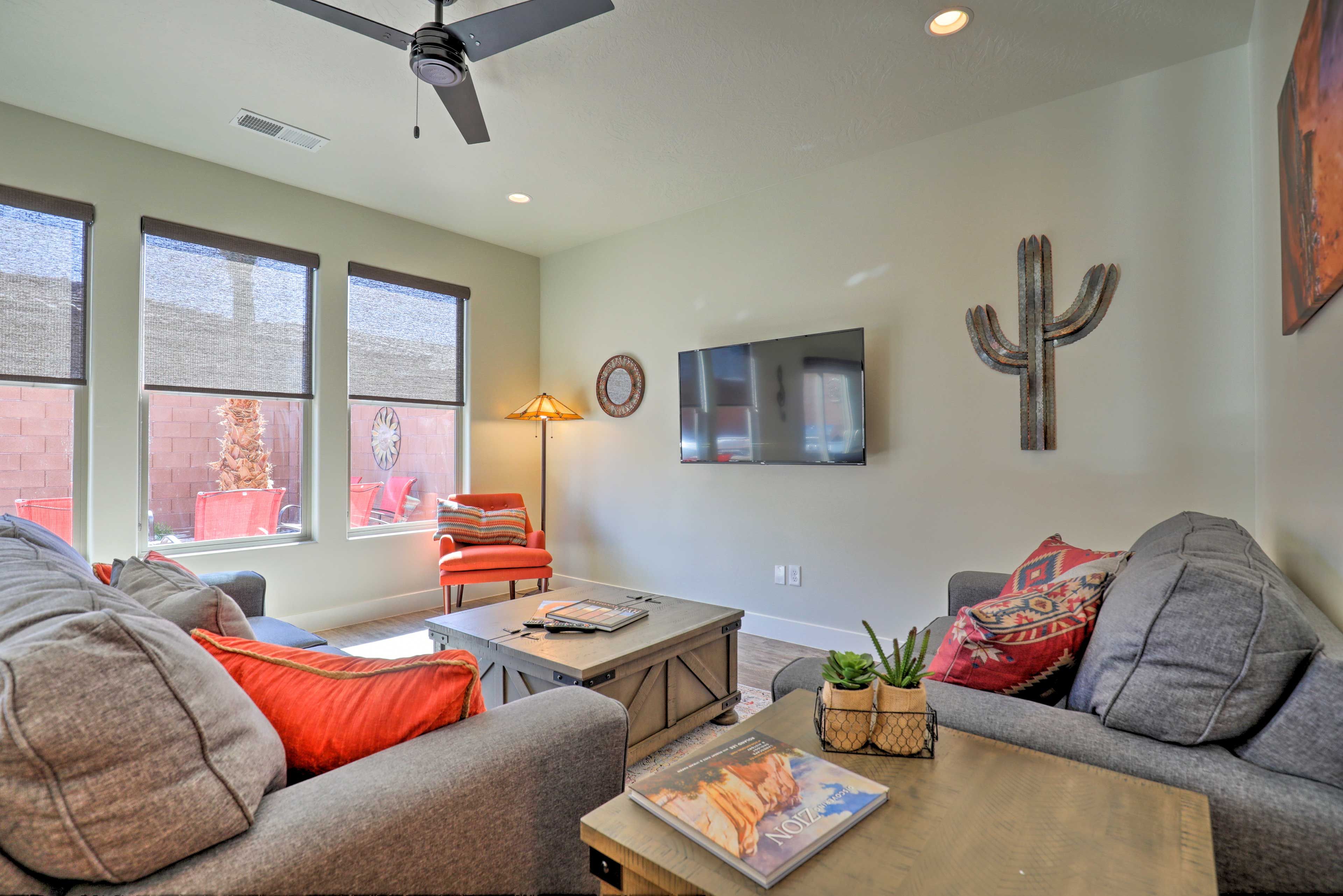 Large windows fill the living room with natural light.