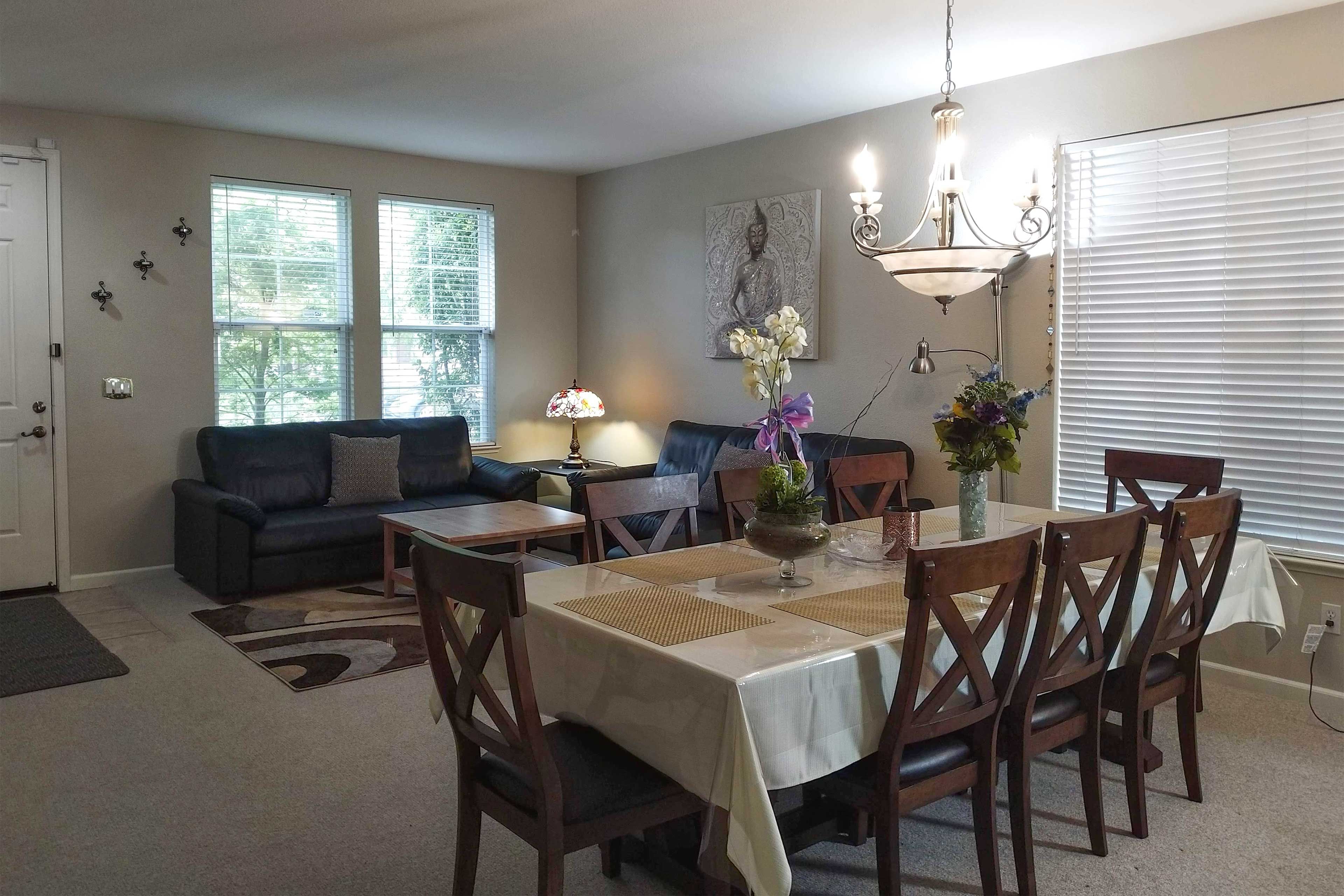 Dine under the light of the chandelier for added ambiance.