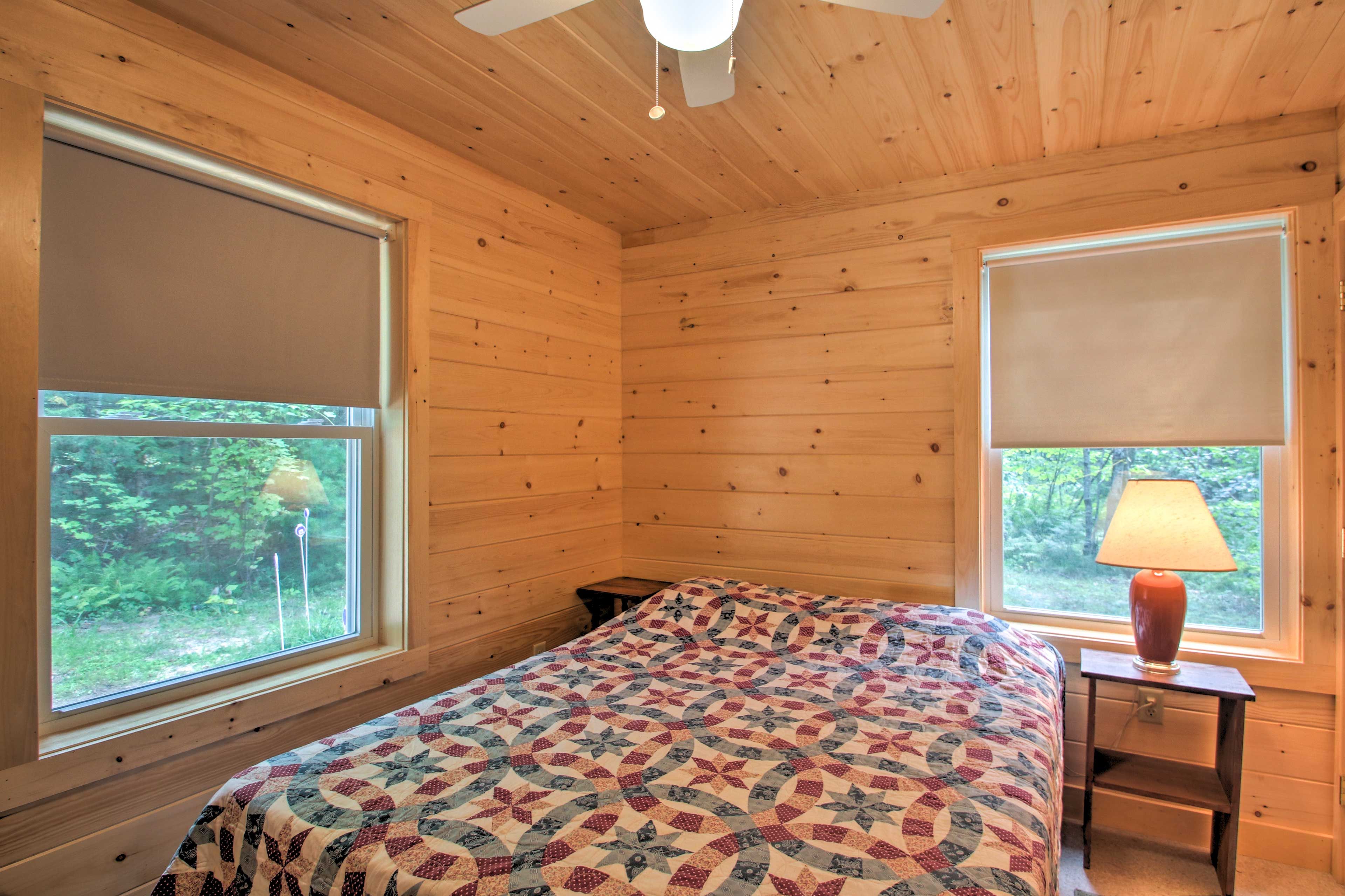 Dream of lake days in the queen-sized bed.