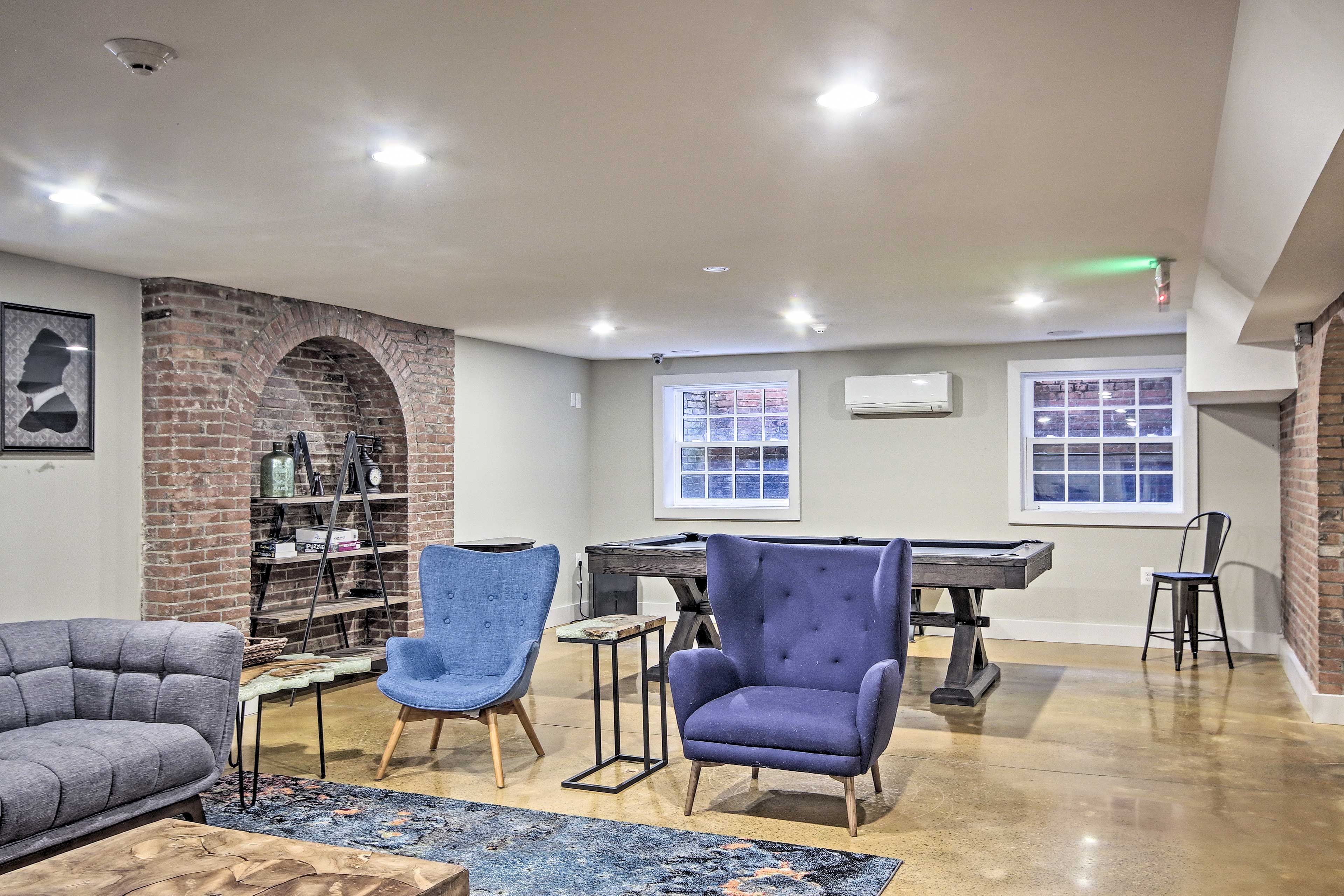 The space features a TV and pool table for entertainment.