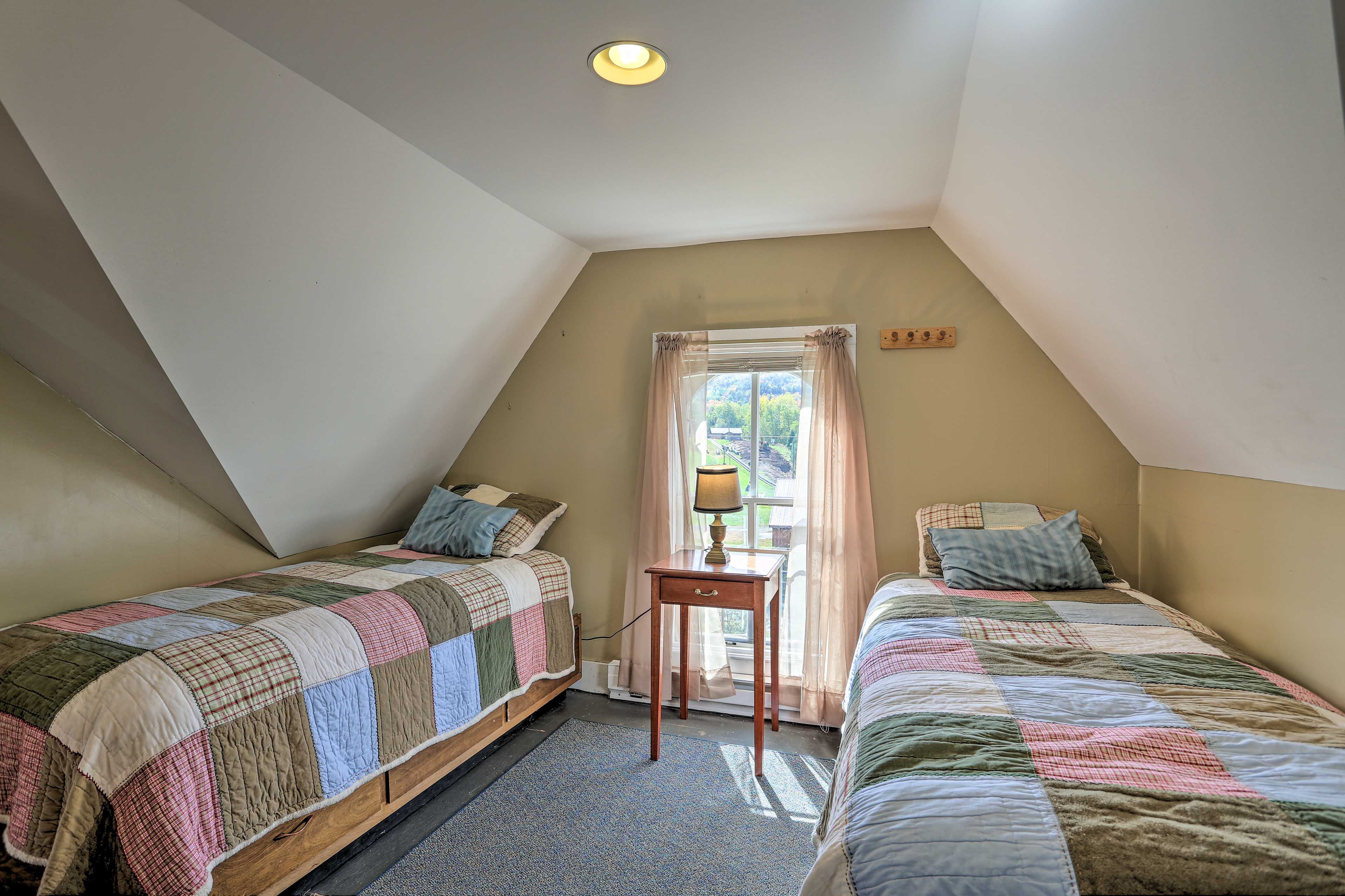 Two twin beds are perfect for sibling sleepovers.