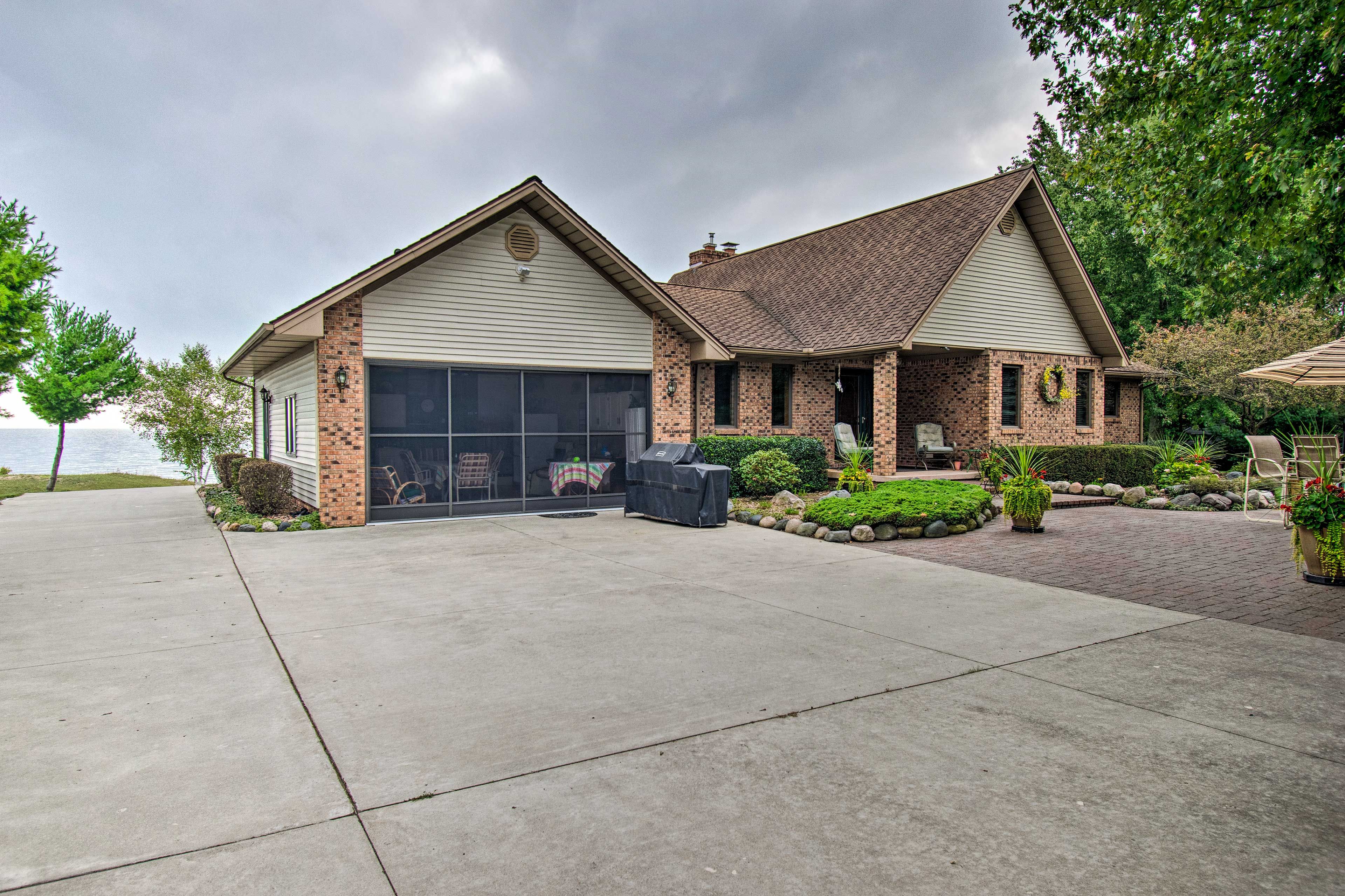 The driveway has room for four vehicles to park.