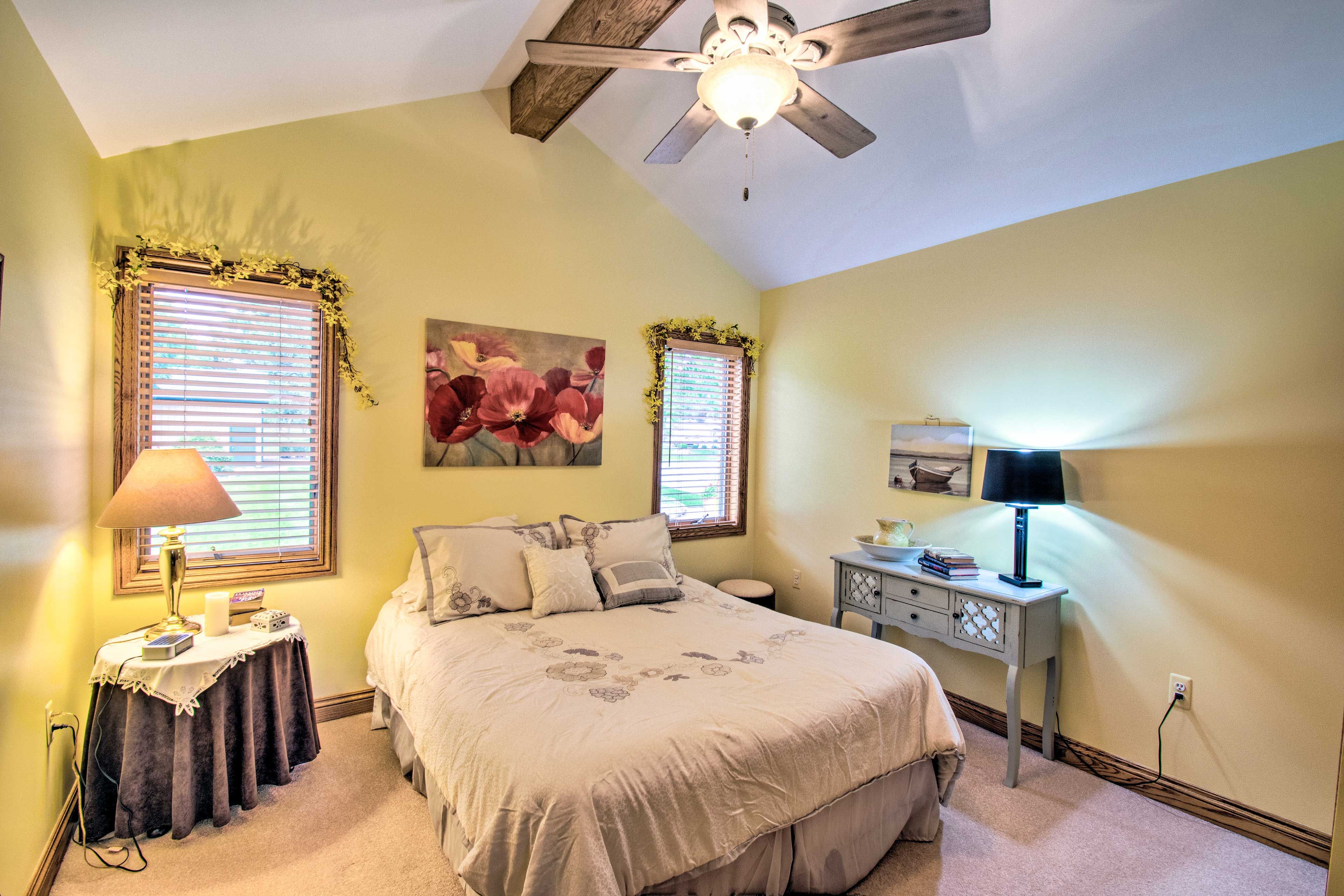 Rest your head in this bedroom's queen-sized bed.