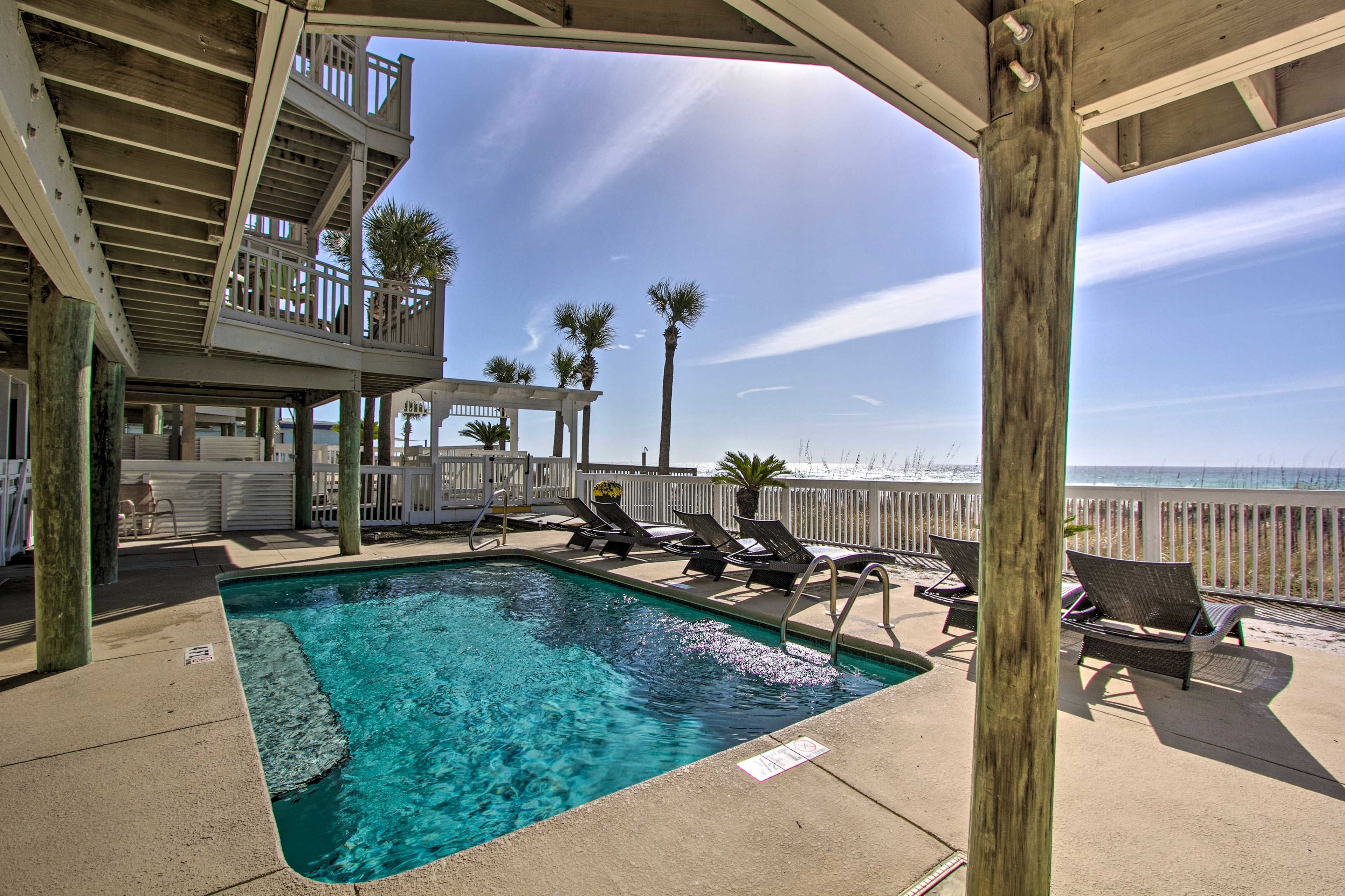 The vacation rental condo has access to a pool and private beach.