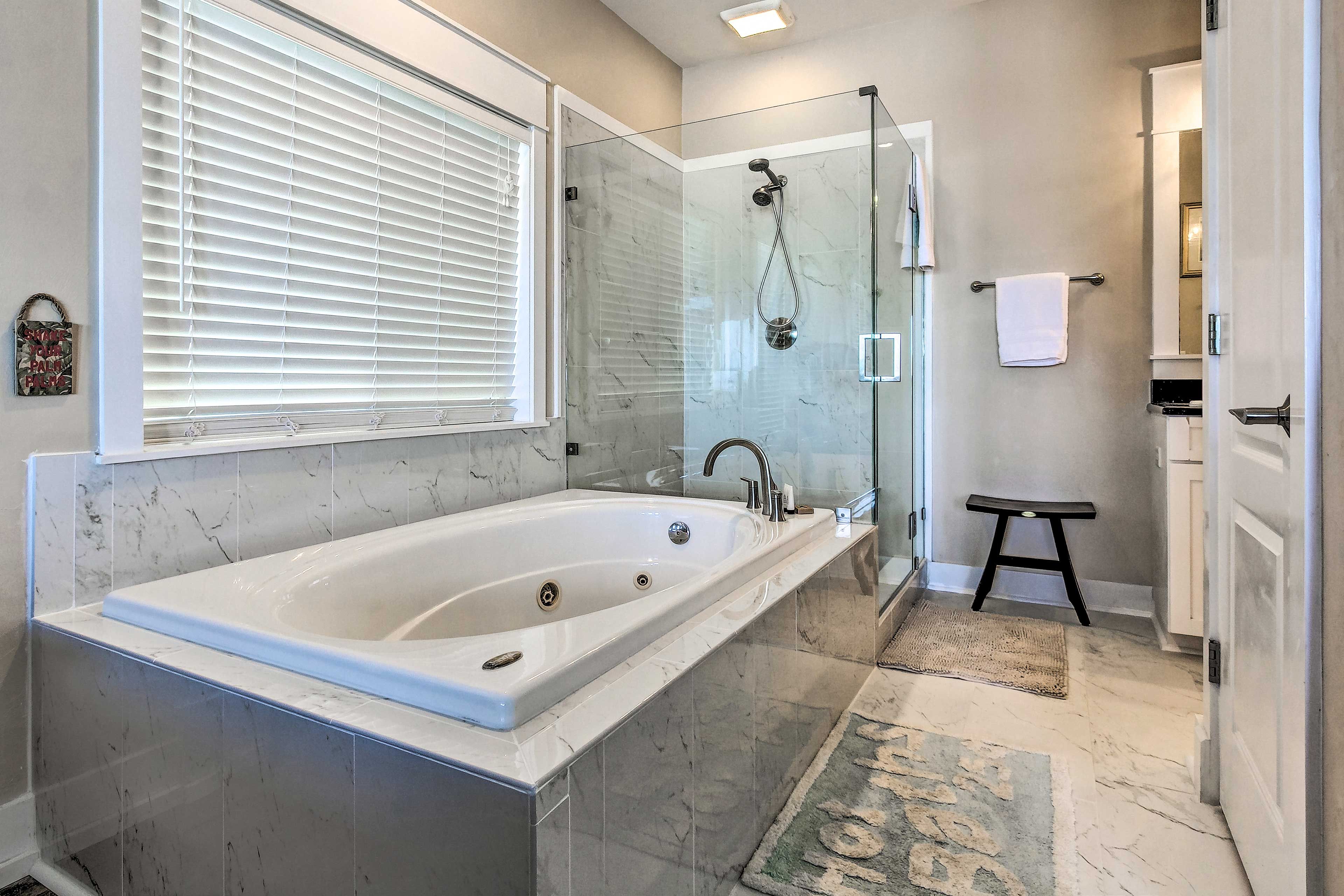 The en-suite bathroom has a jetted tub and walk-in shower.