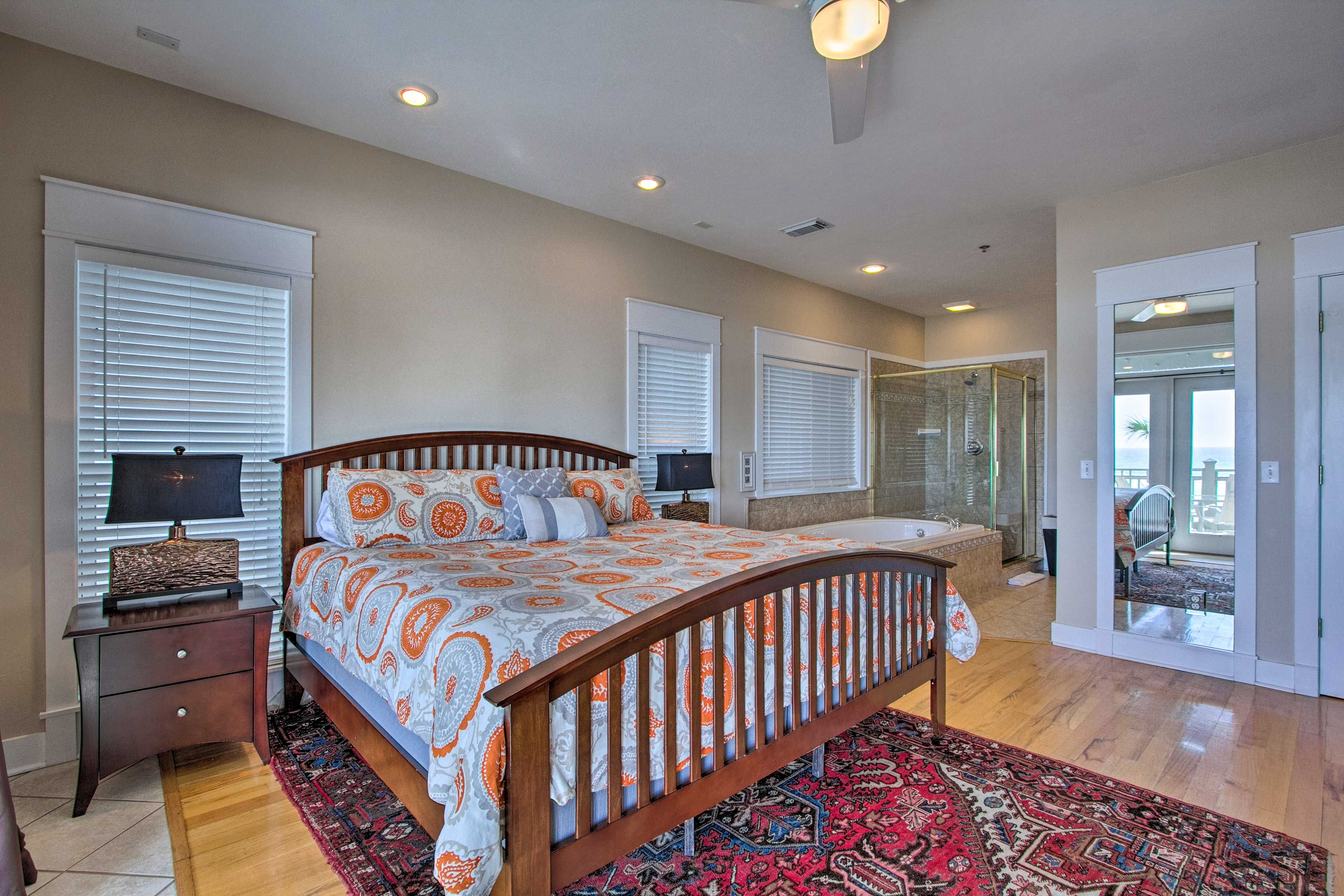 The room includes a king bed and access to the patio.