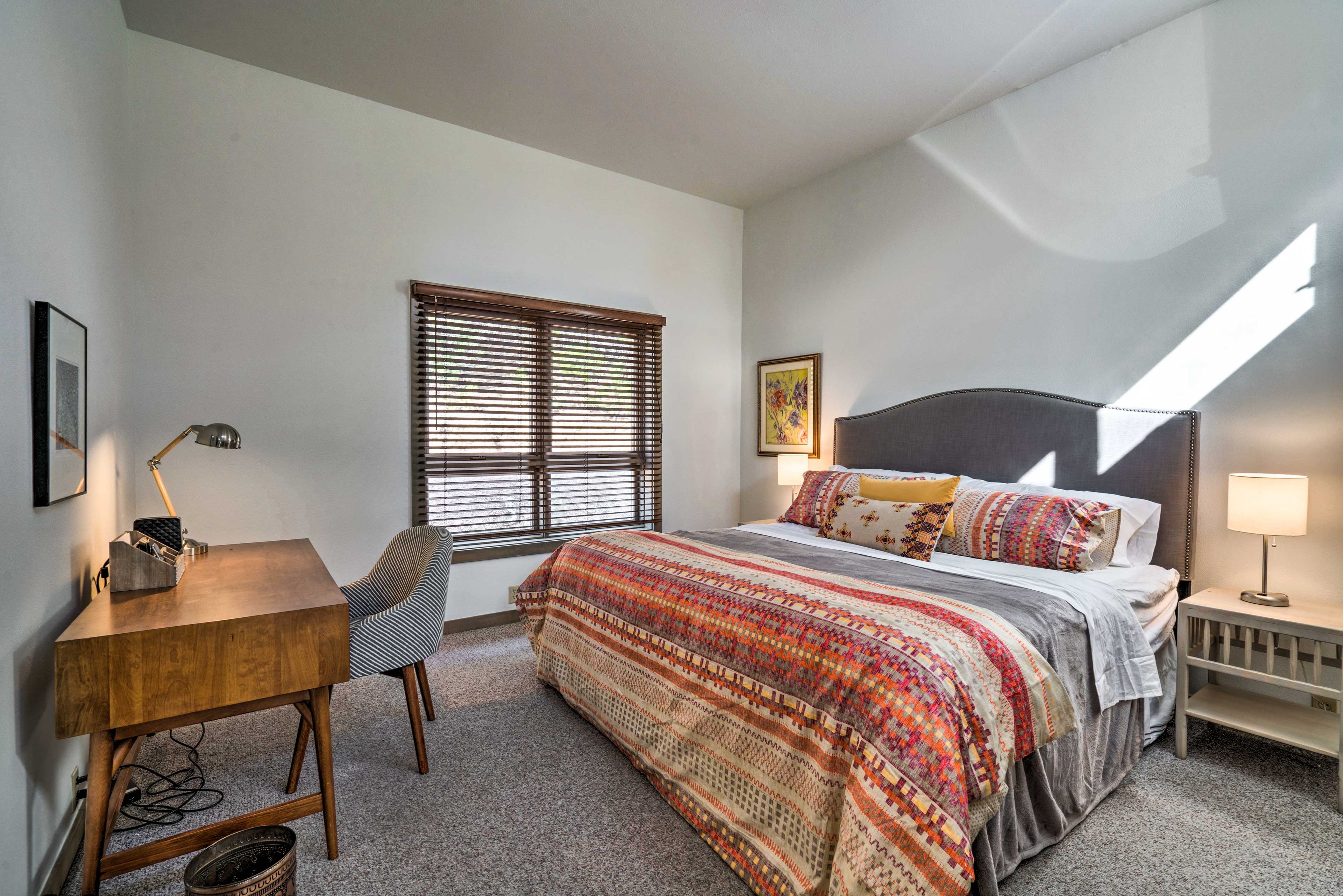 The bright second bedroom also features a king bed.