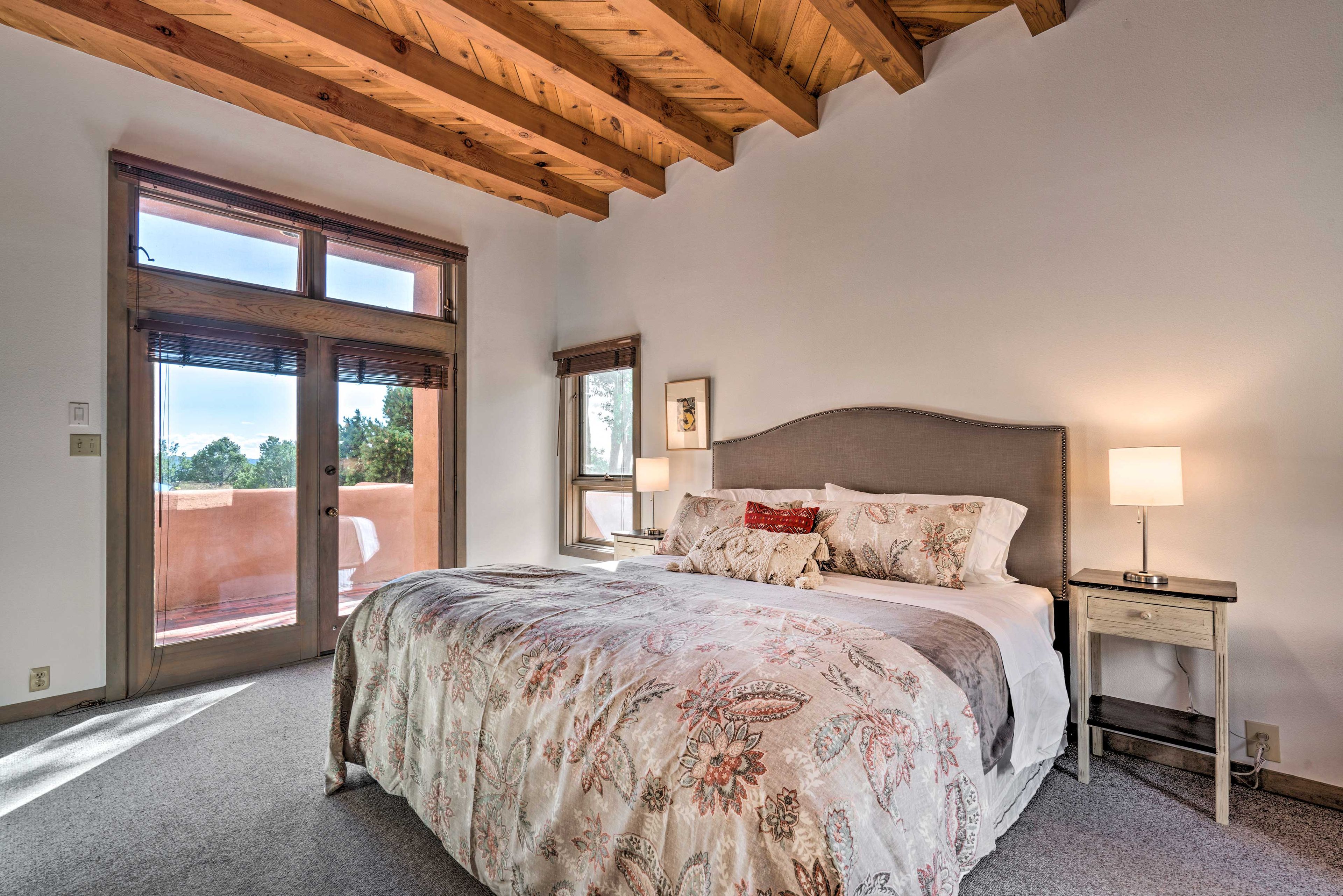 The king-sized accommodation offers direct patio access & en-suite bathroom.