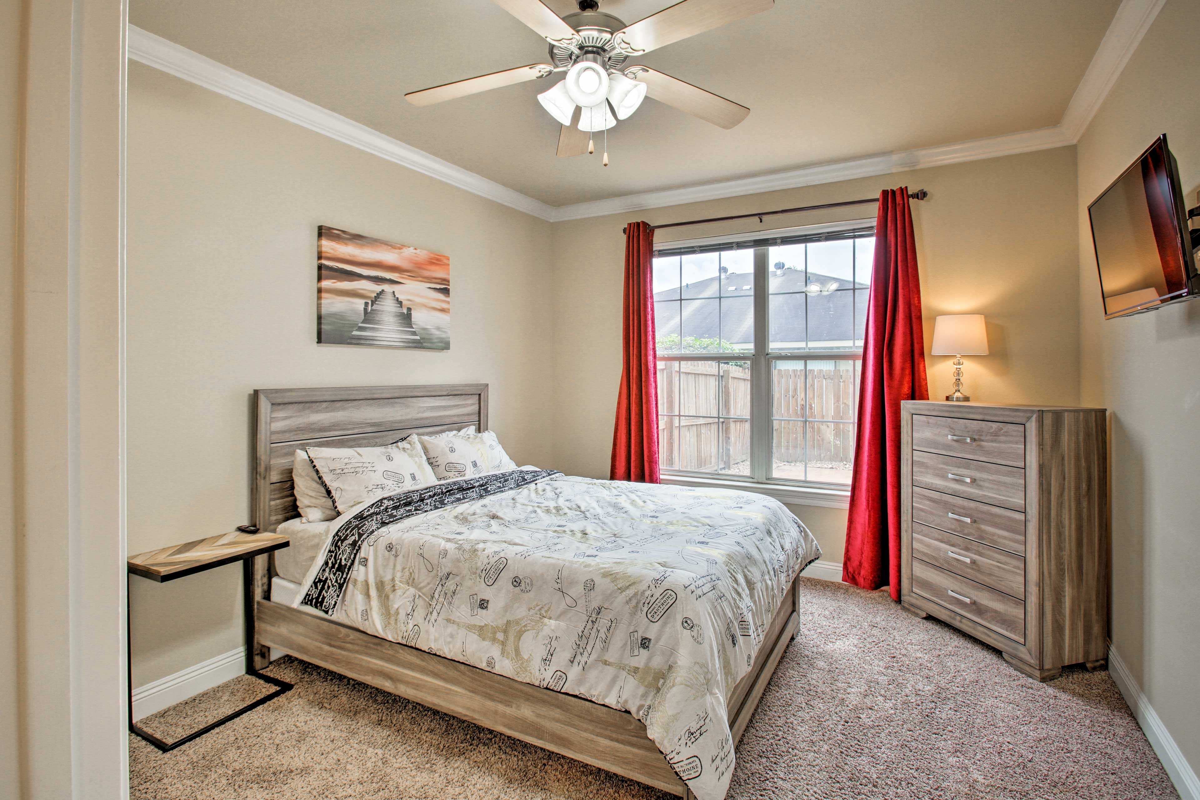 This bedroom is located off the kitchen.