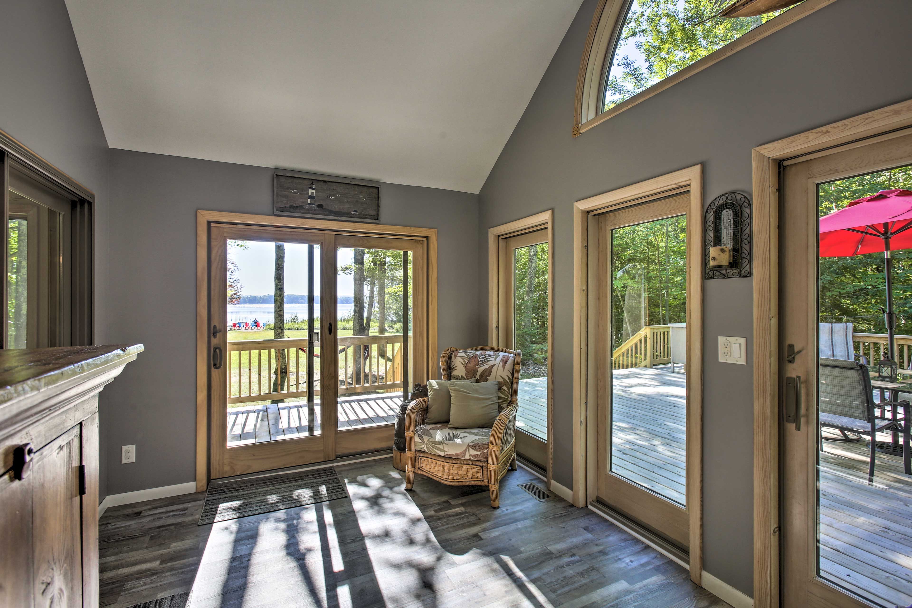 Immersed in trees, the home is a perfect lakeside retreat.