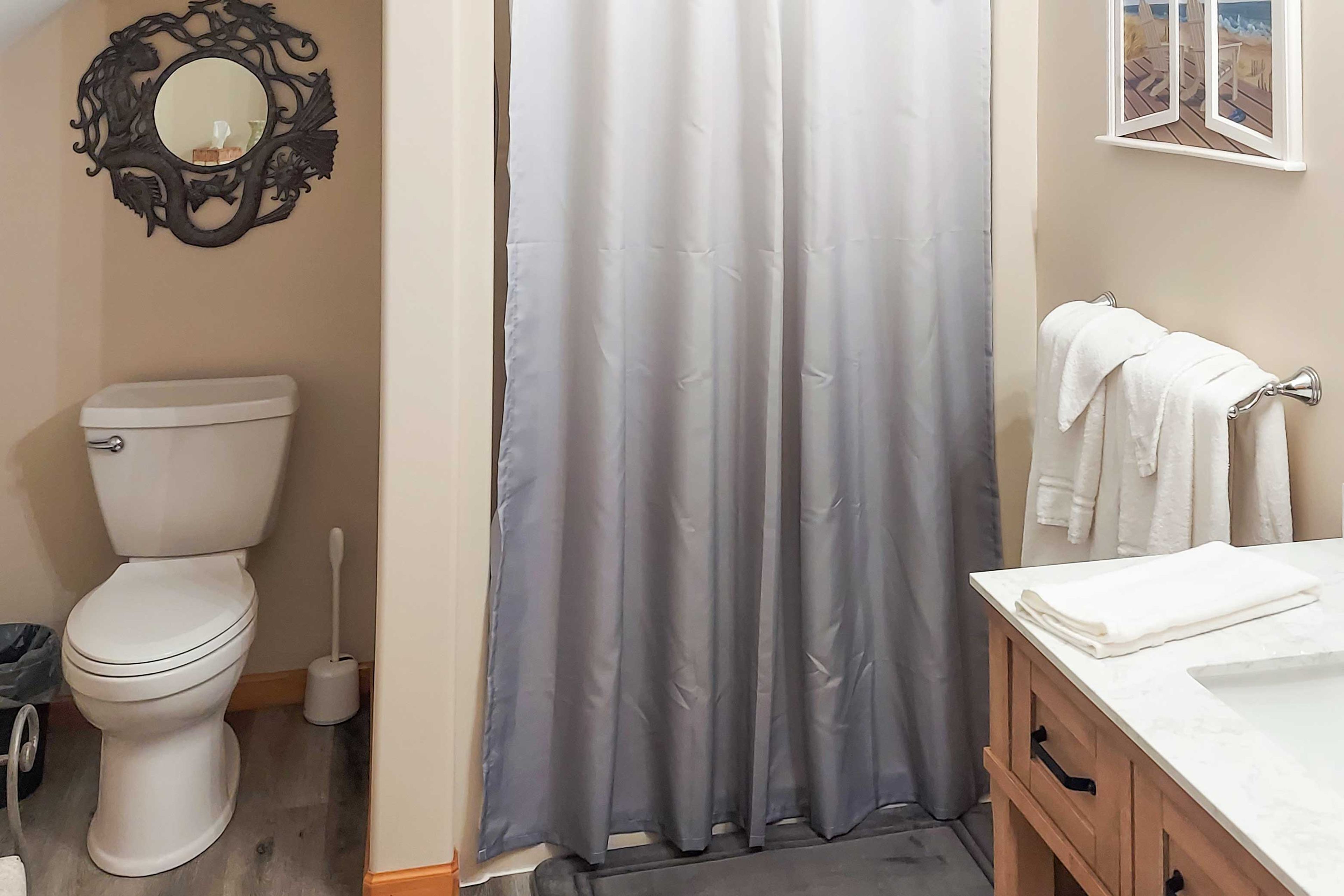 This bathroom features modern finishes and a walk-in shower.