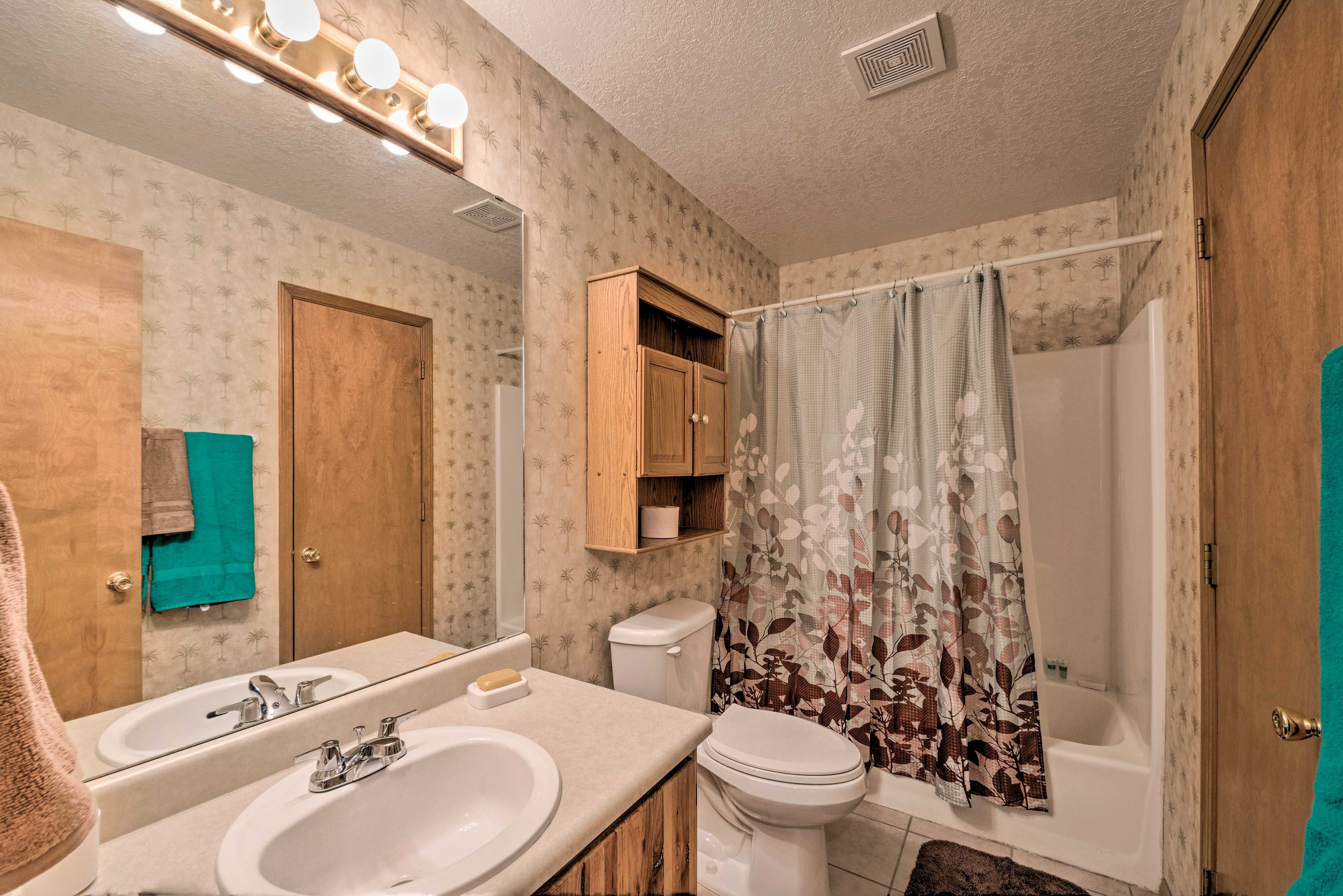 Wash away the day in the shower/tub combo.
