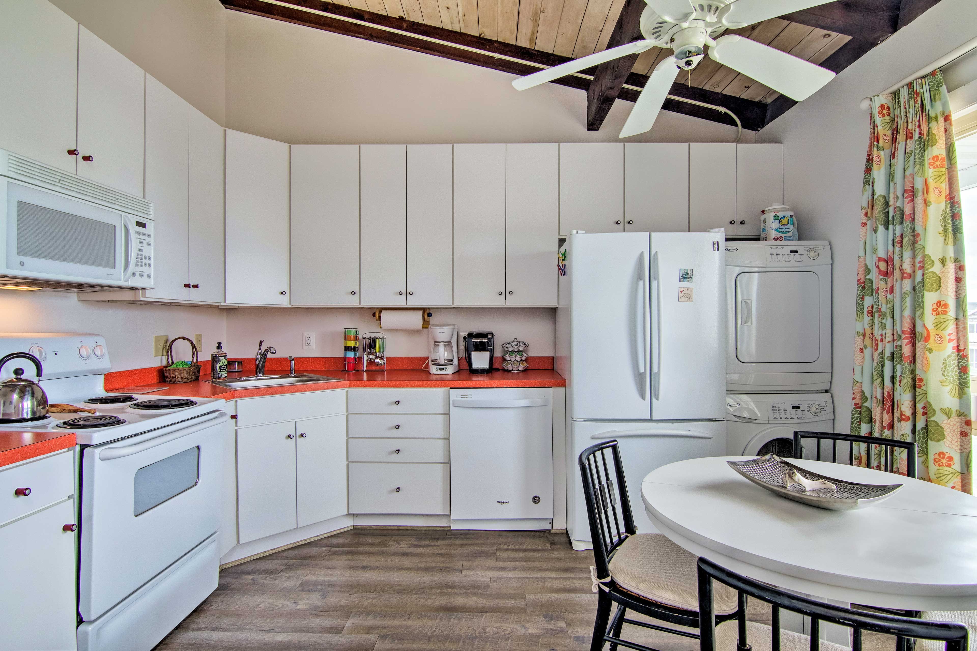This kitchen features a 4-person dining table and all your cooking essentials.